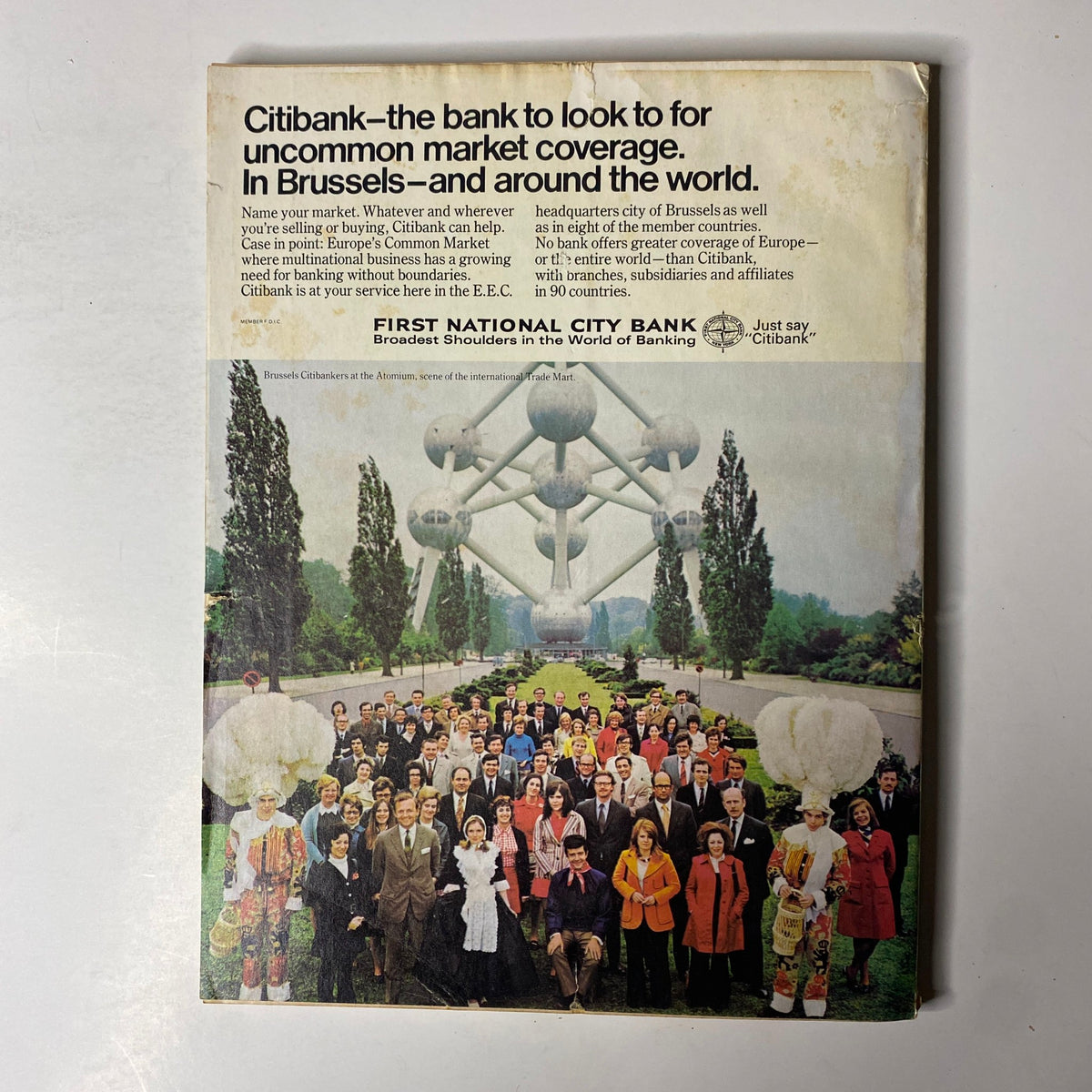 Back cover of Forbes Magazine, January 1, 1973, featuring a Citibank advertisement with a group of Citibankers in front of the Atomium structure in Brussels.