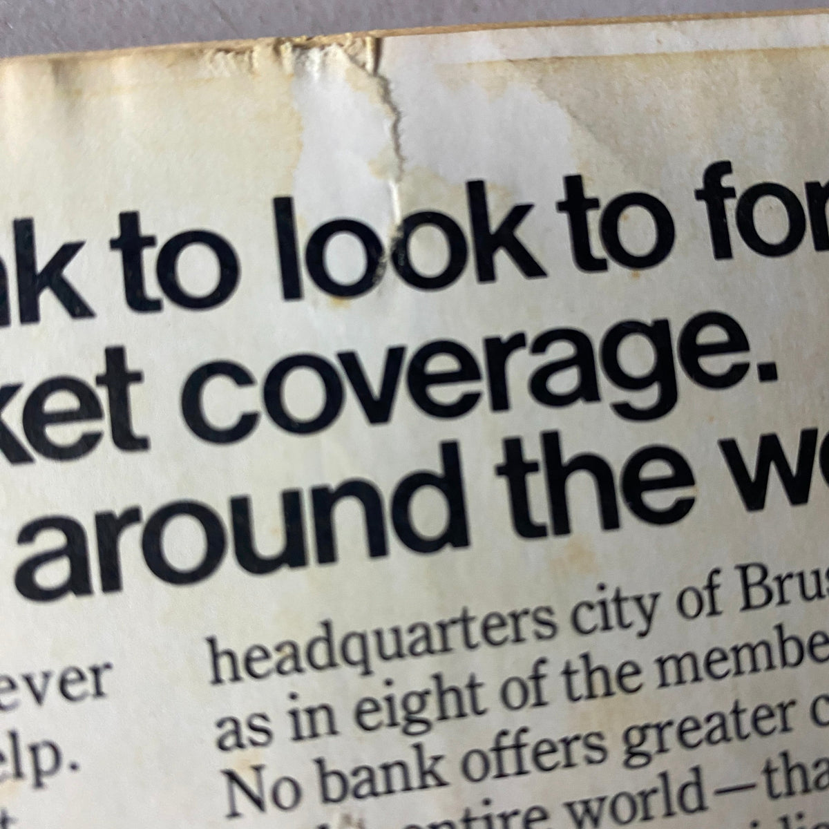 Close-up of the Citibank advertisement text on the back cover of Forbes Magazine, January 1, 1973, discussing market coverage in Brussels and around the world.