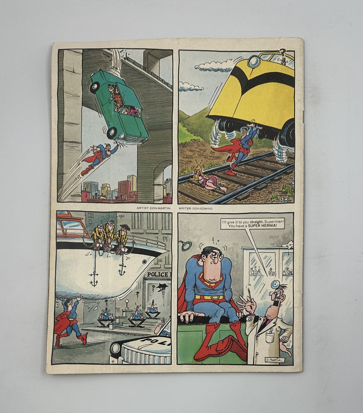 MAD Magazine No. 208 July 1979 featuring Superman in a comic strip illustration showcasing humorous satire, including scenes of Superman engaging in various comedic actions with cars and trains.