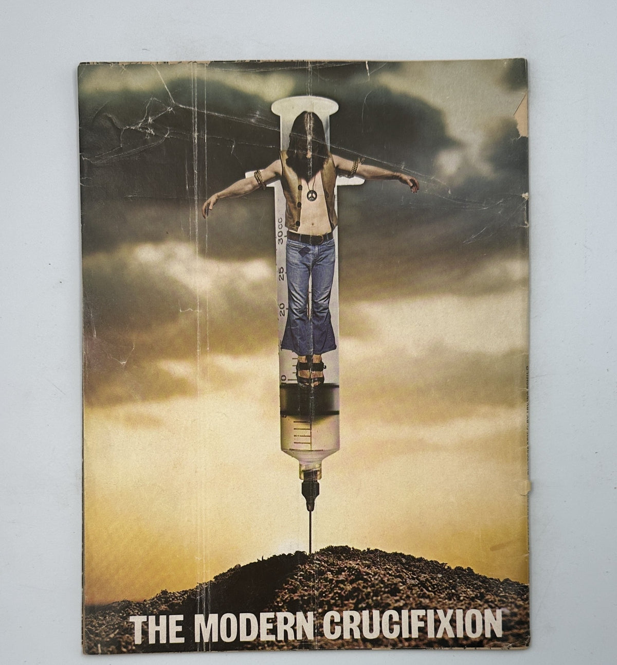 Back cover of MAD Magazine No. 145 from September 1971 showing a surrealistic image titled 'The Modern Crucifixion' featuring a person depicted on a large syringe.