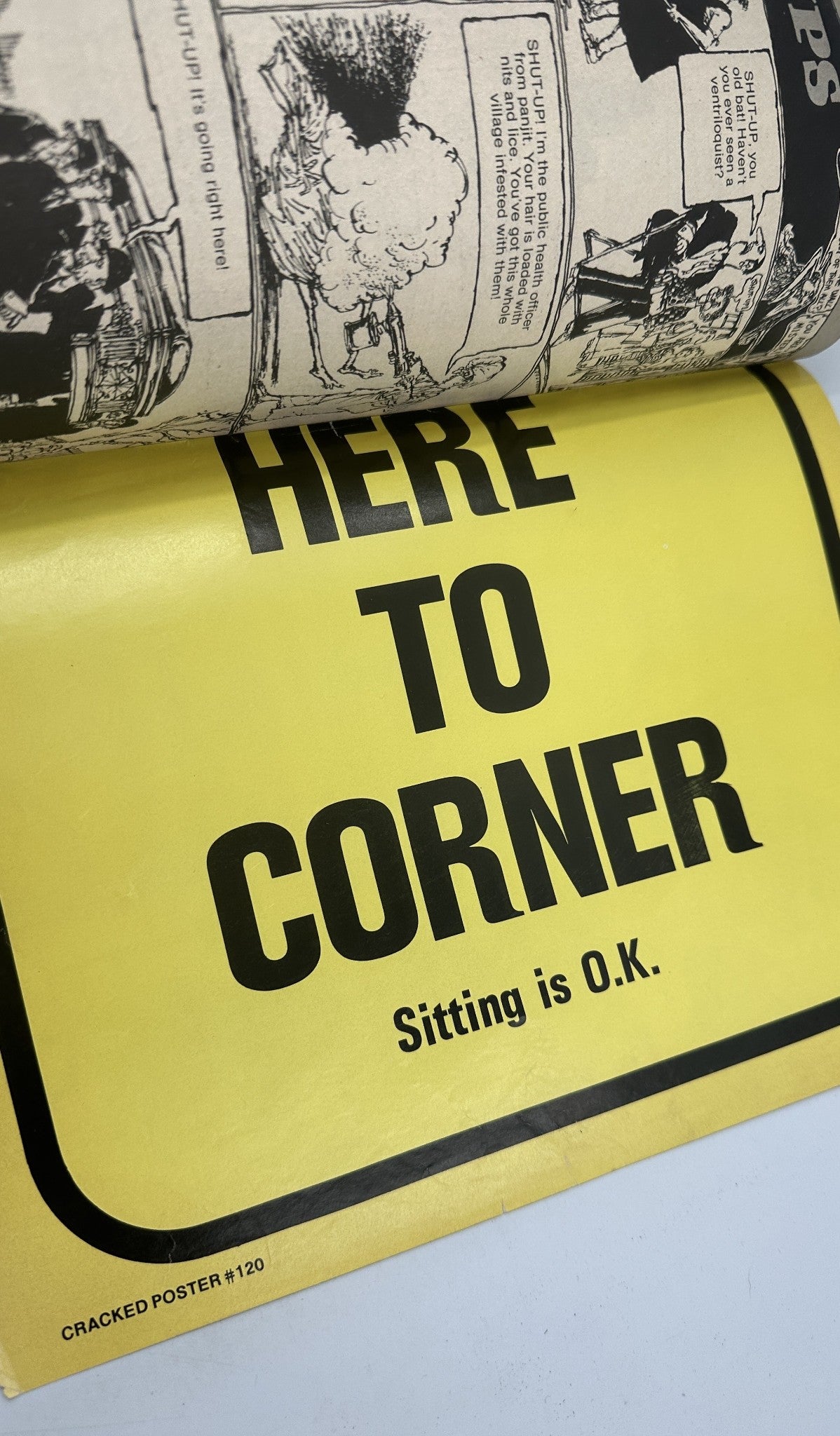 Image of a yellow sign 'HERE TO CORNER' displayed in Cracked Magazine No. 120, October 1974, promoting humor from within the magazine.