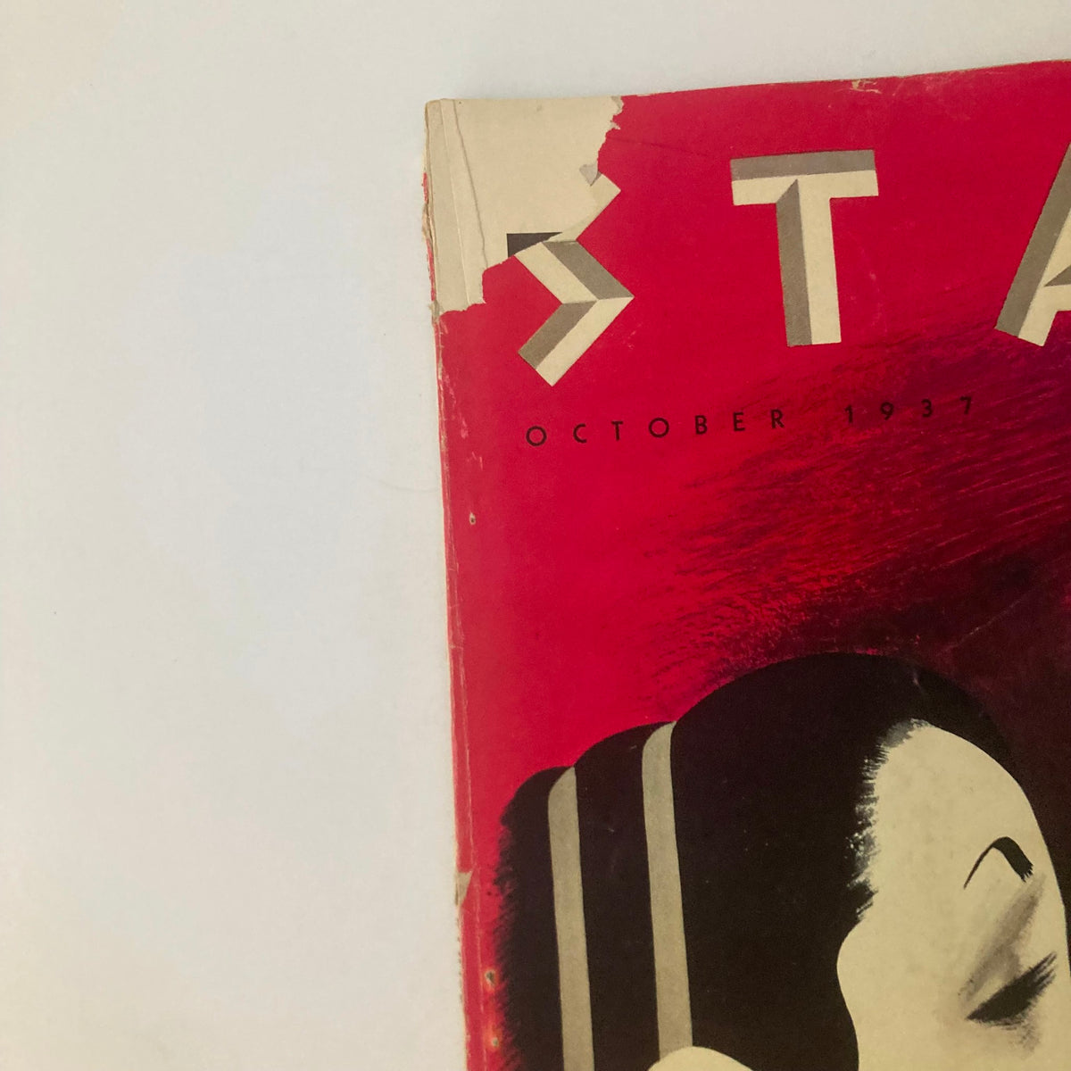 Close-up view of the top section of the VTG Stage Magazine October 1937 cover, highlighting date and vintage artistic elements.