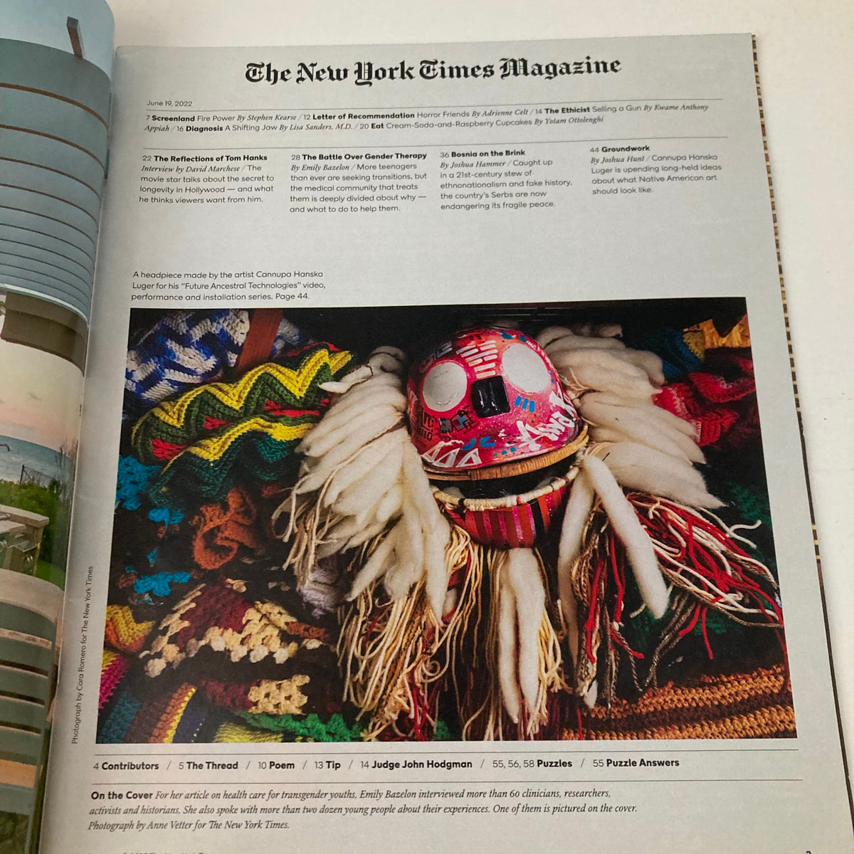 Inside page of The New York Times Magazine June 19, 2022 showcasing colorful textiles and a traditional mask, highlighting cultural aspects related to the issue of gender therapy.