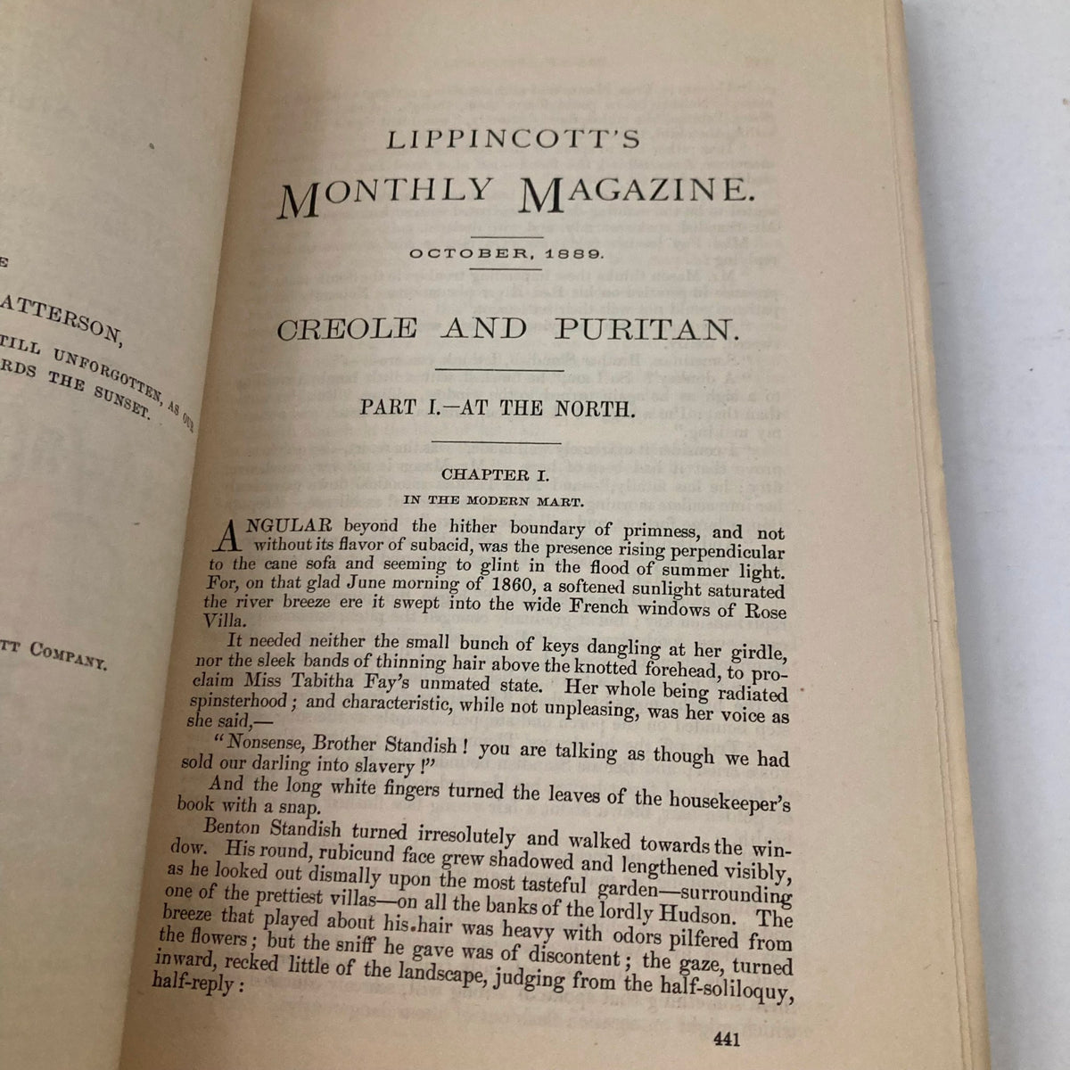 Lippincott's Magazine October 1889 cover page with the title 'Creole and Puritan', showcasing the beginning of a literary chapter discussing cultural themes in the modern north.