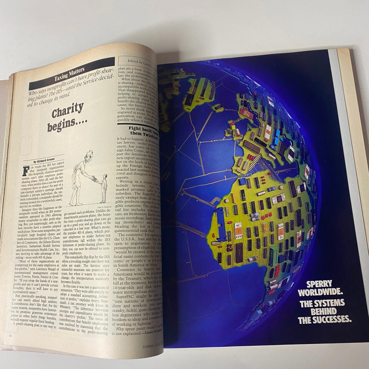 Forbes Magazine April 29, 1985, featuring an article on charity with an illustration and a globe, emphasizing the discussion of nonprofit profit-sharing.