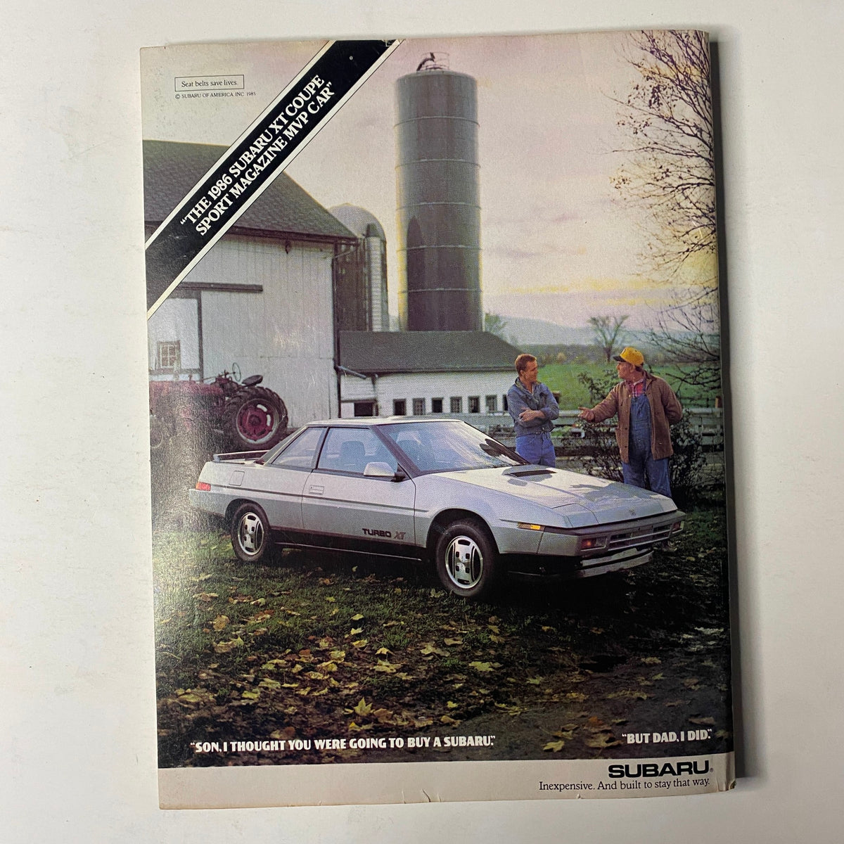 Cover image of Forbes Magazine from January 13, 1986, featuring the 38th Annual Report on American Industry, showcasing two men discussing beside a silver Subaru XT sports coupe, emphasizing economic trends of the 1980s.