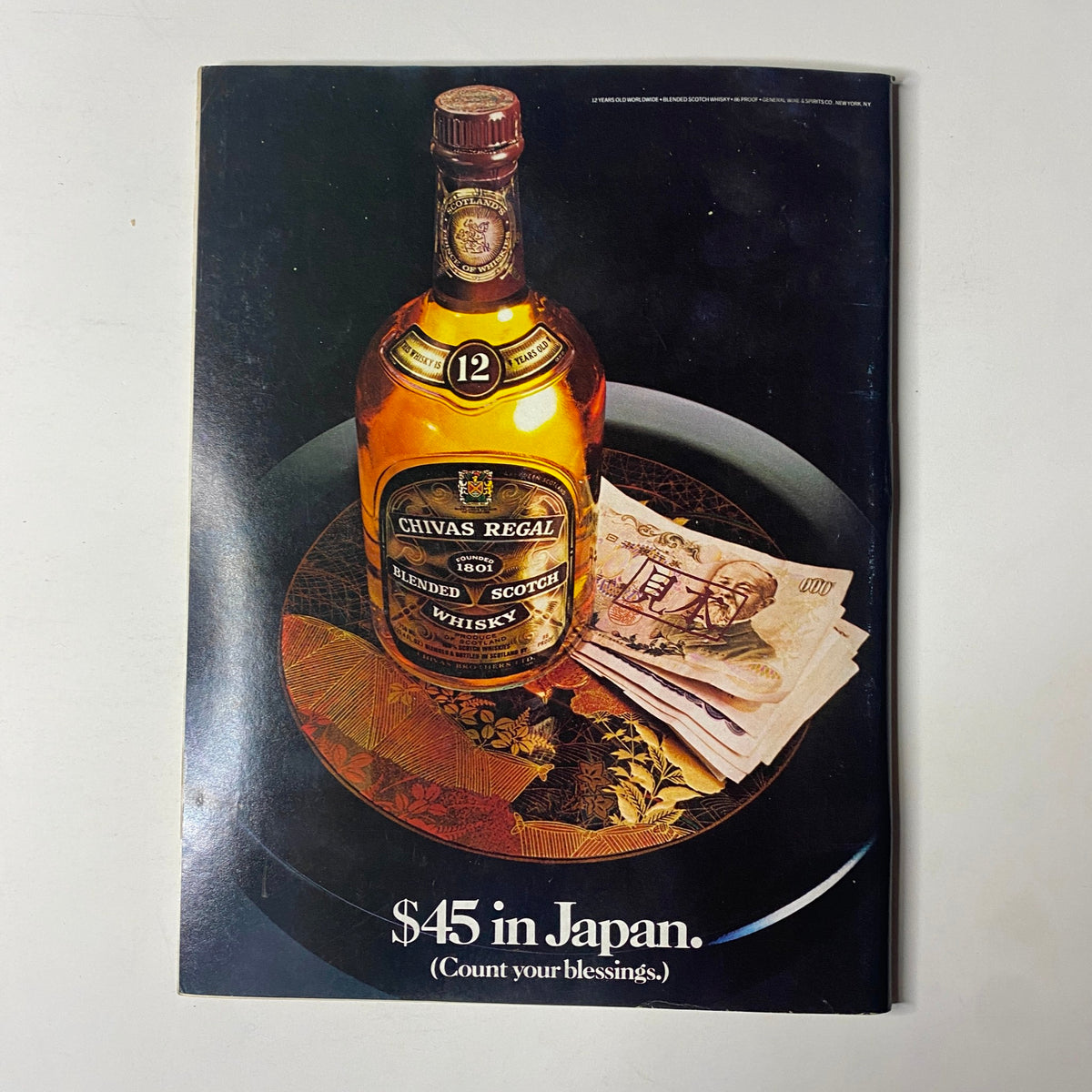 Forbes Magazine September 26, 1983, featuring an advertisement for Chivas Regal Scotch whisky placed alongside Japanese currency, with the text '$45 in Japan. Count your blessings'.