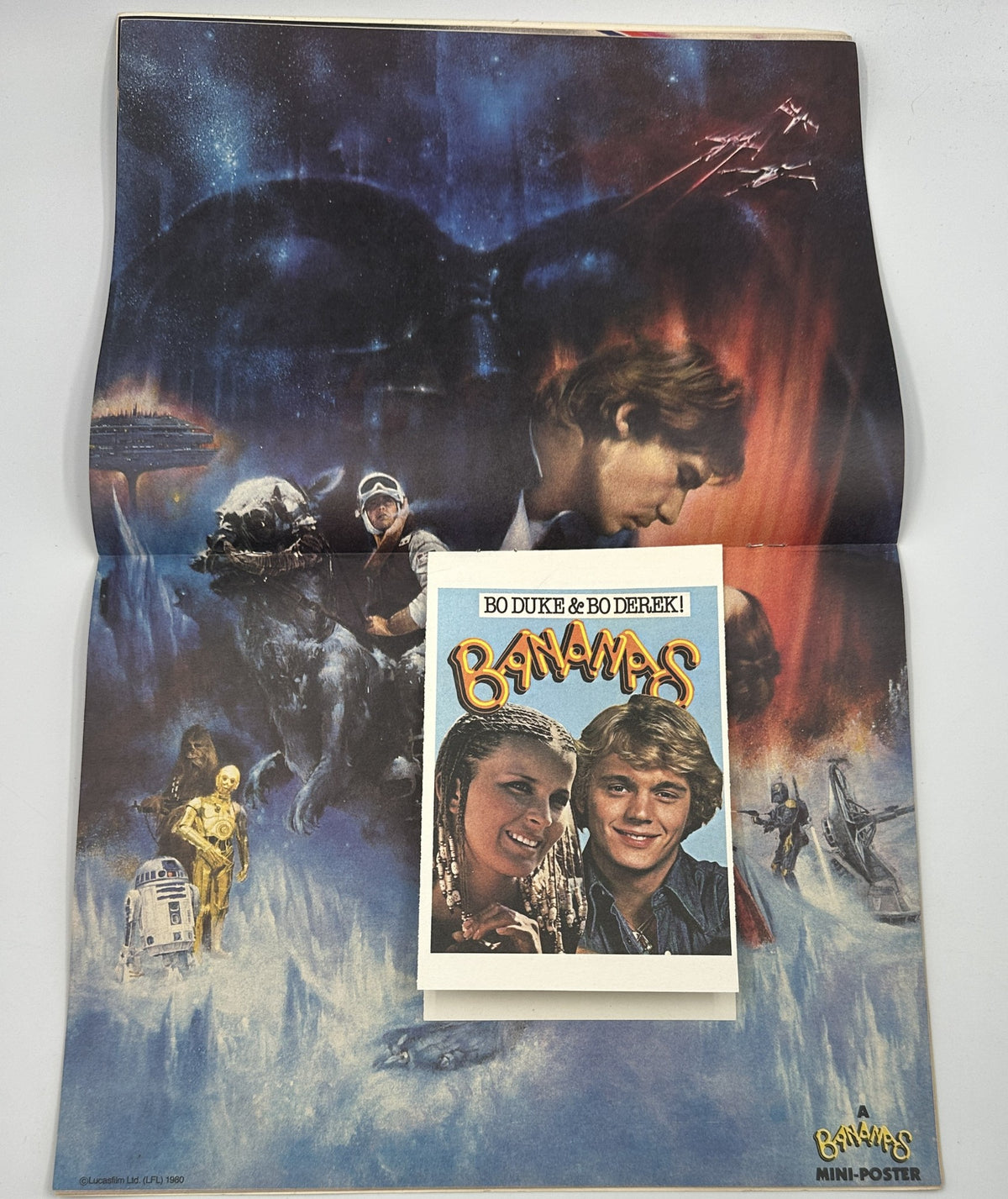 Mini-poster from Bananas Magazine No. 39 displaying Bo Duke and Bo Derek against a sci-fi backdrop, themed with Star Wars elements.