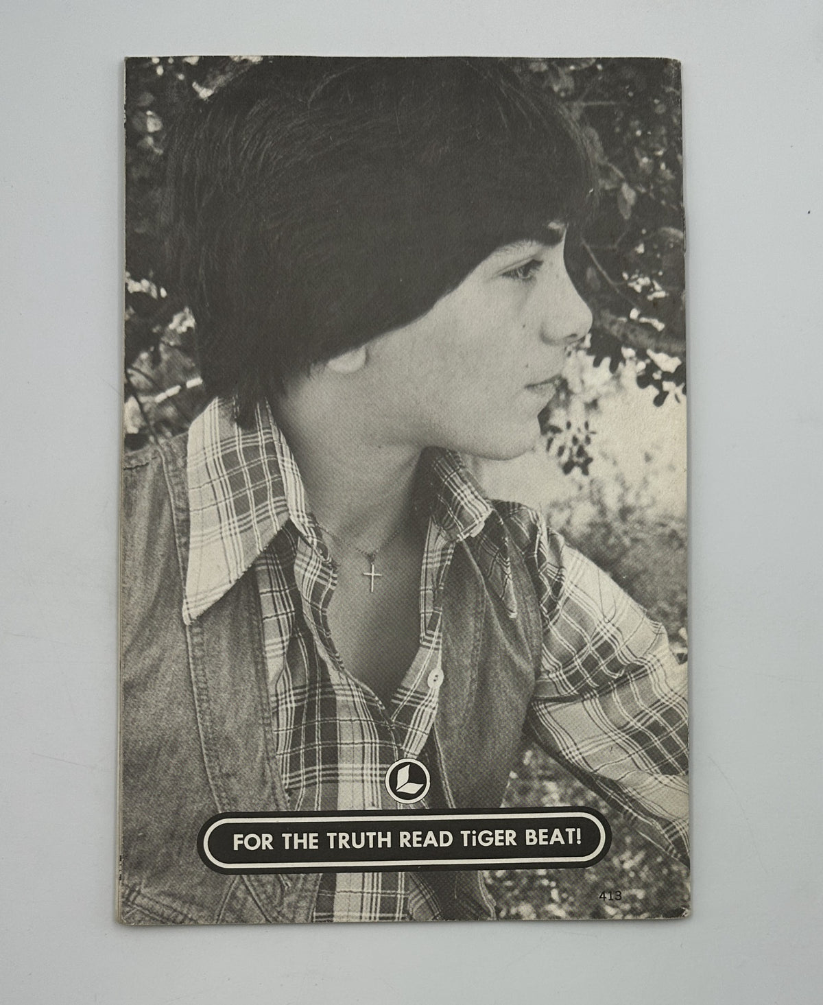 Scott Baio’s Personal Photo Album Magazine showing a side profile of a young Scott Baio, emphasizing his iconic hairstyle and casual look, typical of a 1970s teen idol.