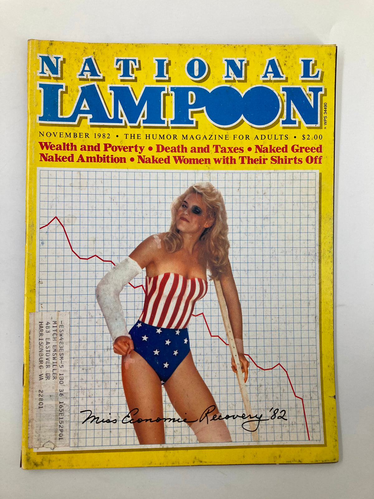 Cover of National Lampoon Humor Magazine from November 1982 featuring 'Miss Economic Recovery'. The magazine showcases humorous themes such as wealth and poverty, and includes a graphic design with a model in a red and white striped top and blue star-patterned shorts.