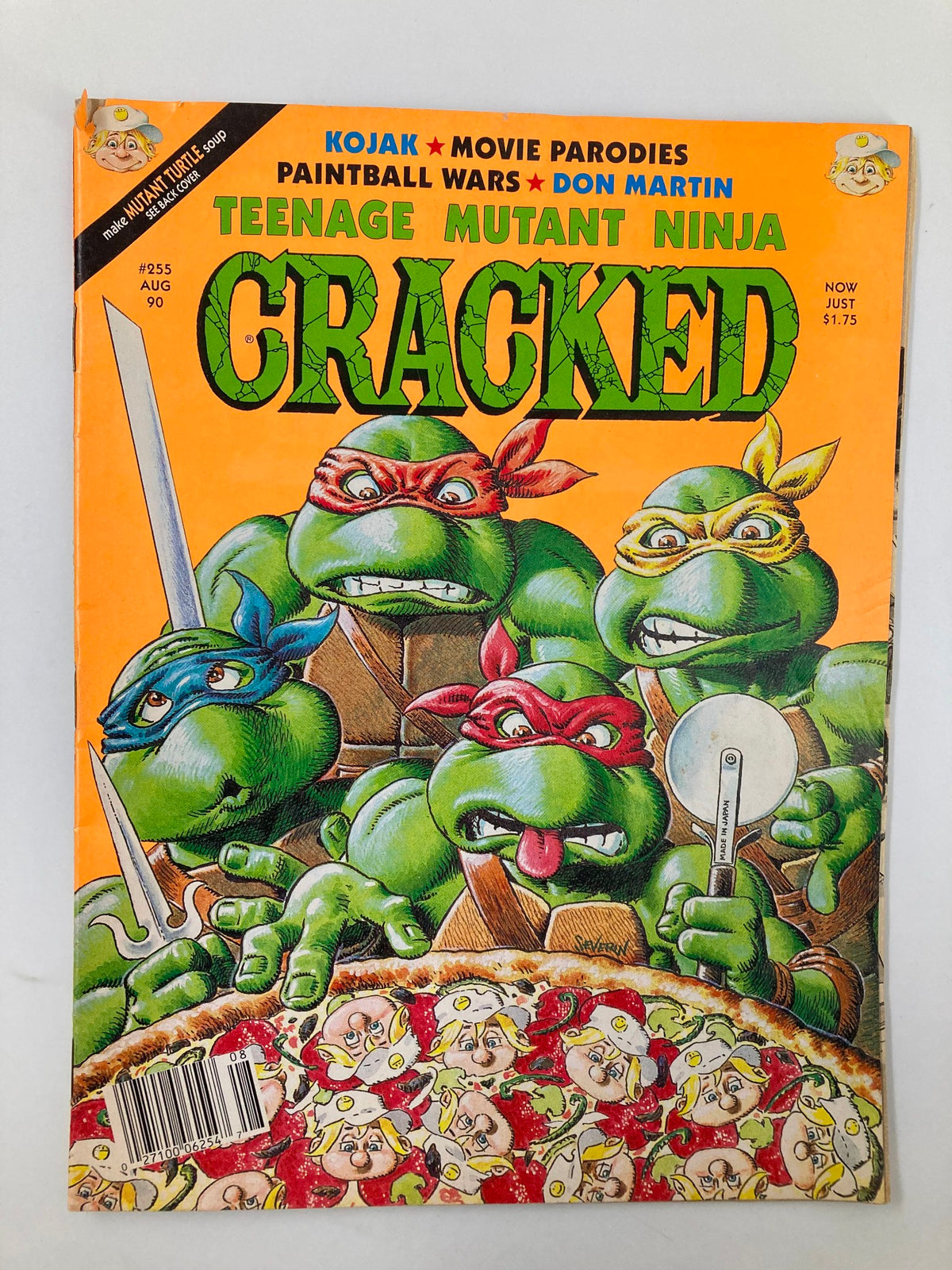 Cracked Humor Magazine August 1990 cover featuring Teenage Mutant Ninja Turtles, showcasing vibrant colors and playful artwork. Magazine issue number 255, highlighting themes of movie parodies and humor.