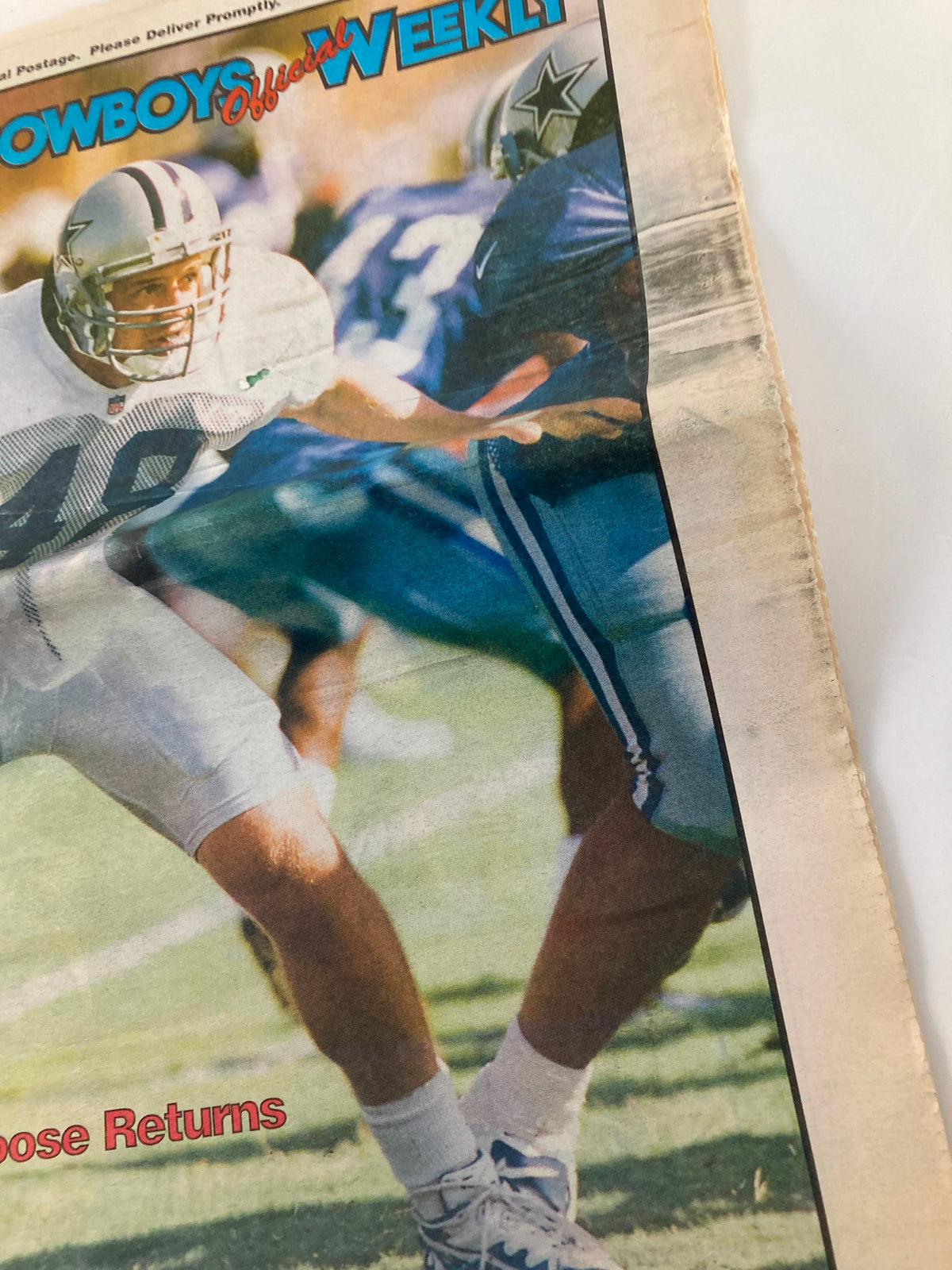 Close-up of the cover of Dallas Cowboys Weekly Newspaper from August 8, 1998, highlighting the headline 'The Moose Returns' and featuring players on the field.