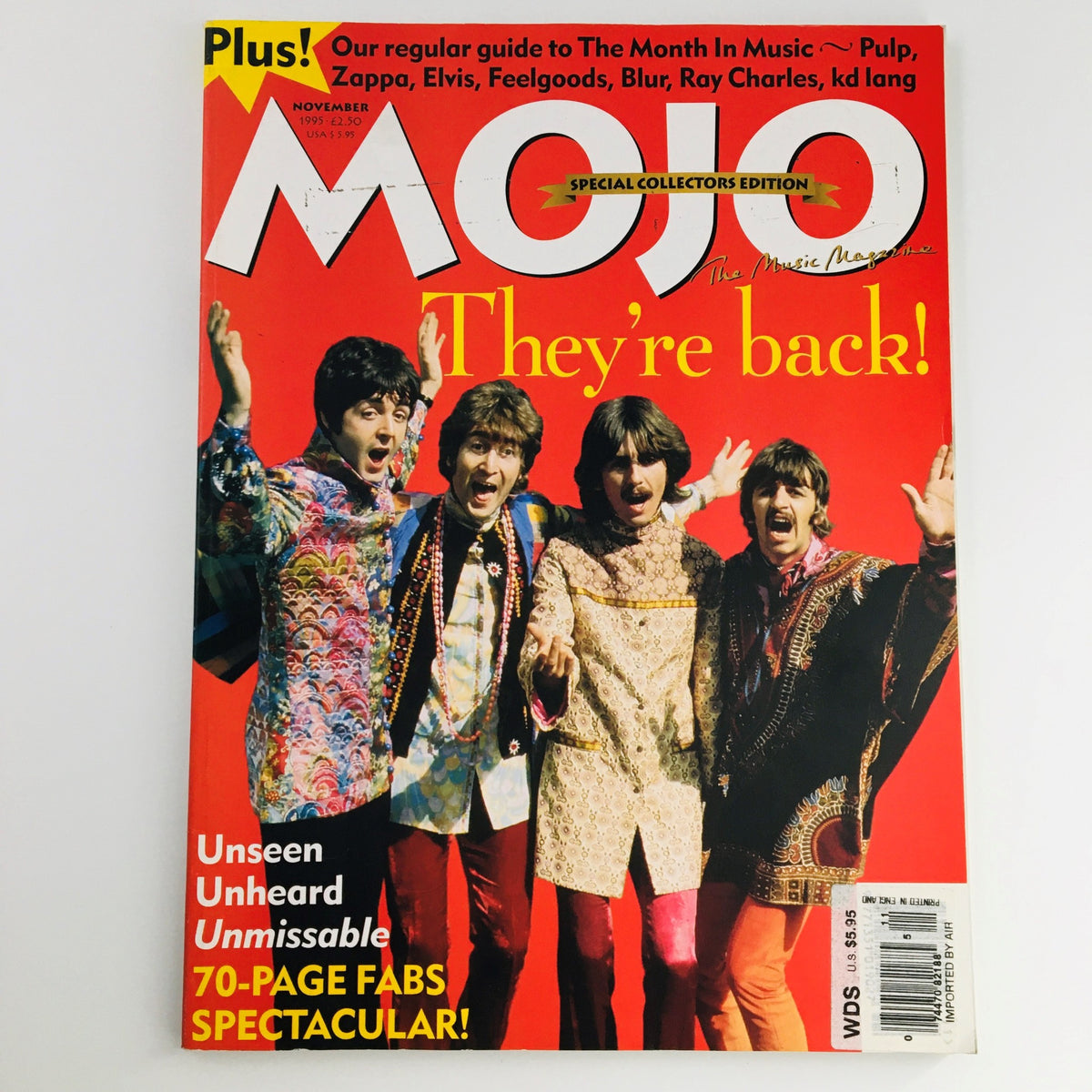Mojo Magazine November 1995 cover featuring The Beatles with the headline 'They're Back!' showcasing vibrant colors and iconic imagery from the 90s music revival.