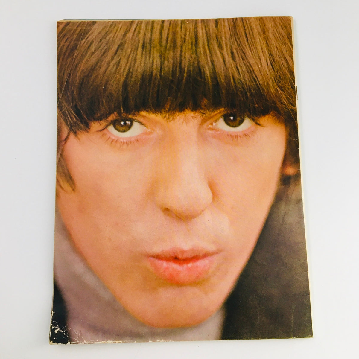 Cover image of the 16 Scoop Magazine from 1965 featuring The Beatles, showcasing a close-up portrait of George Harrison with his signature hairstyle, highlighting the essence of the Fab Four's story from their rise to fame.