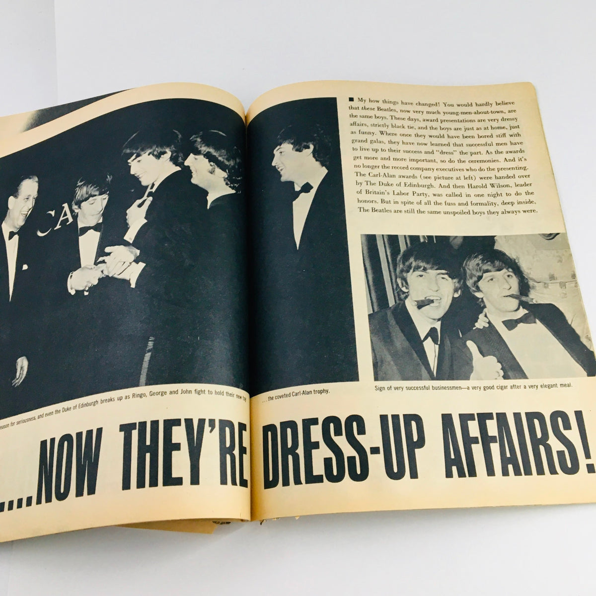 1964 The Beatles Are Back and Visit Their Home Fab Photos - An interior page illustrating The Beatles at a formal event, highlighting their evolution from casual performers to celebrated artists.