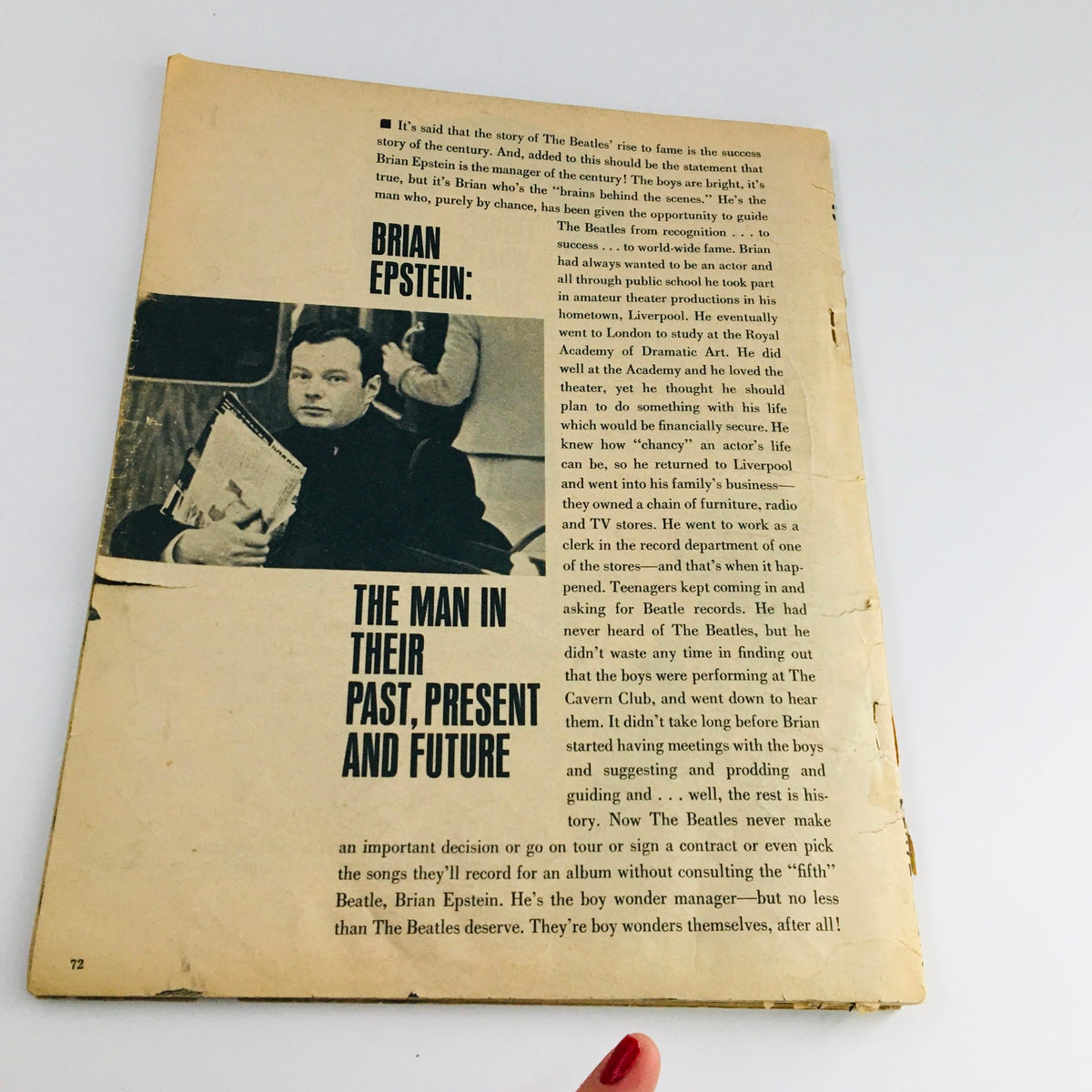 Back cover of the 1964 The Beatles Are Back and Visit Their Home Fab Photos magazine. The image features text discussing Brian Epstein, the band's manager, and captures the essence of The Beatles' rise to fame. It highlights Epstein's role in their success and provides a vintage feel with its aged condition.