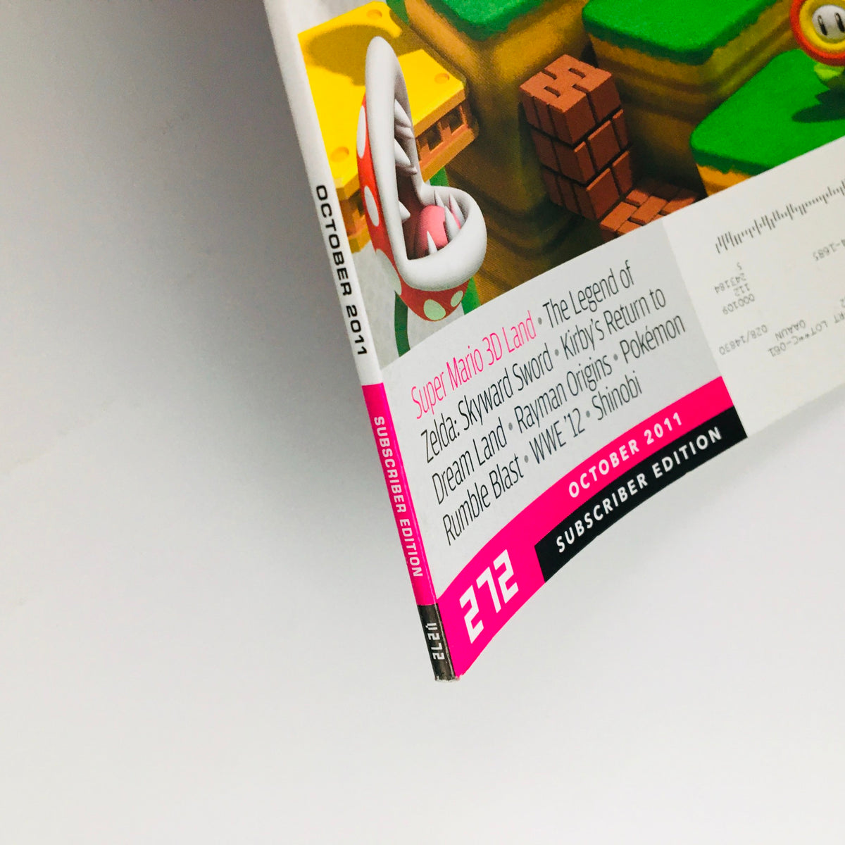 Side view of Nintendo Power Magazine October 2011, emphasizing the title and issue number, highlighting features like Super Mario 3D Land and Zelda: Skyward Sword.