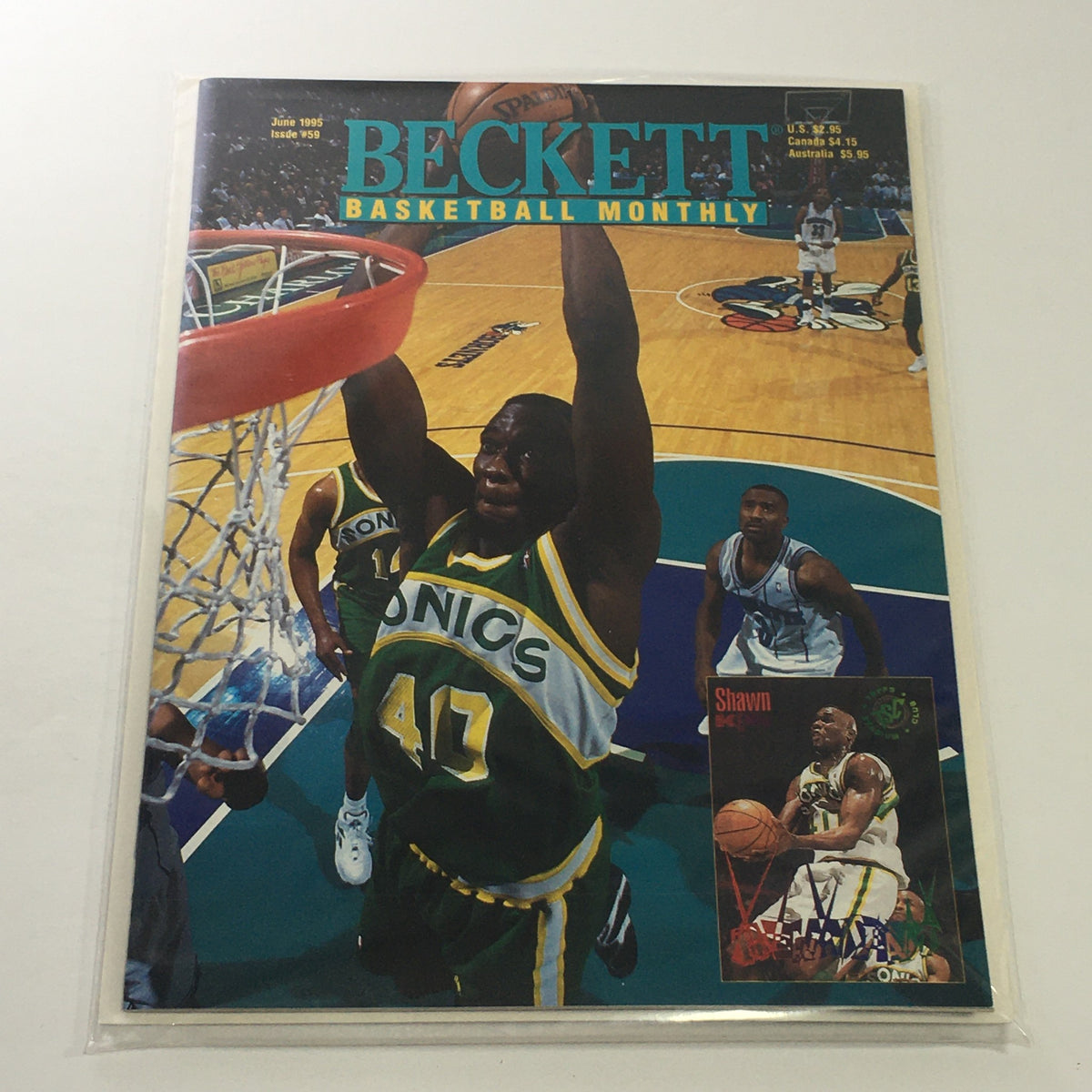 Beckett Basketball Monthly: June 1995 Issue #59 featuring Shawn Kemp dunking during a game, showcasing the excitement of 90s basketball culture.