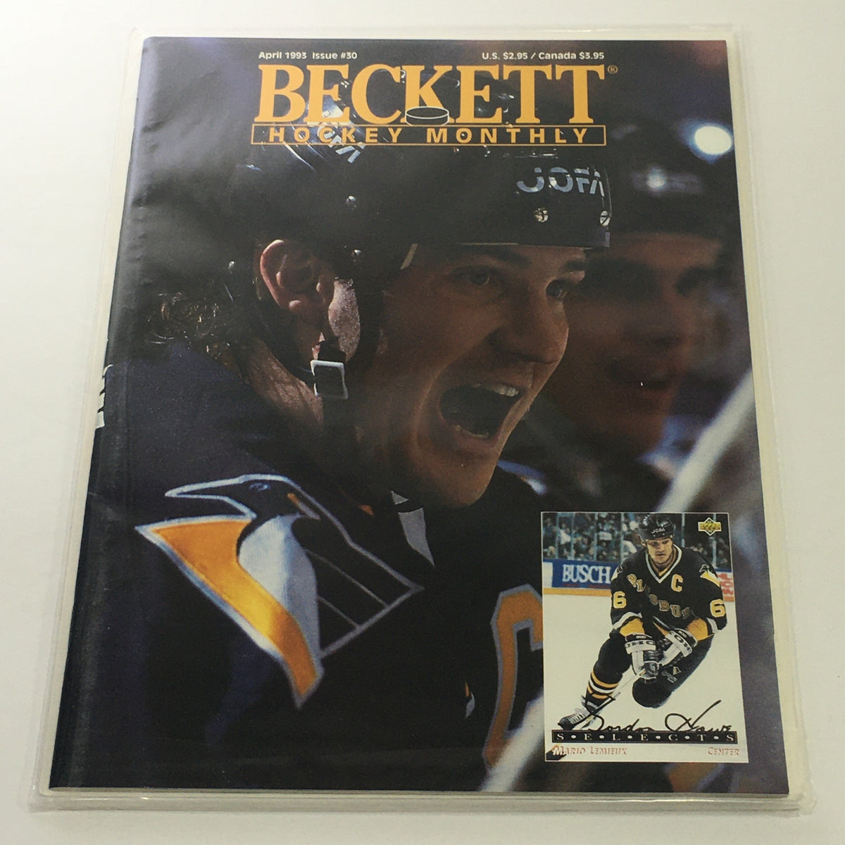 Beckett Hockey Monthly: April 1993 Issue #30 cover featuring an intense Mario Lemieux celebrating, showcasing his Pittsburgh Penguins jersey and a collectible card.