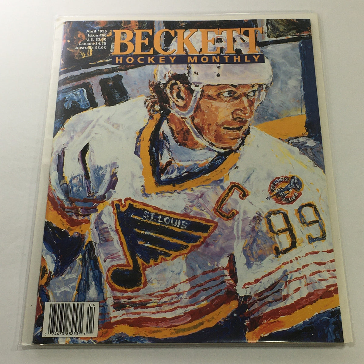 Beckett Hockey Monthly: April 1996 Issue #66 featuring a colorful cover illustration of a hockey player in a St. Louis Blues jersey, showcasing the iconic player number 99. Perfect condition, bagged and boarded.
