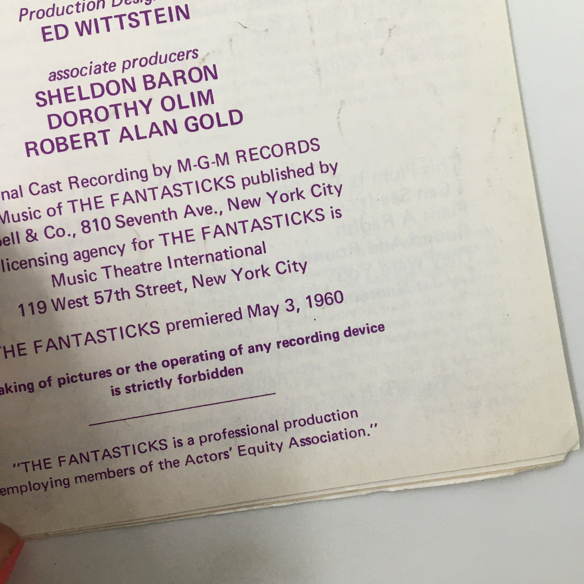 Close-up of production details from the original 1960 Playnews for 'The Fantasticks' by Tom Jones, including credits for design and production.