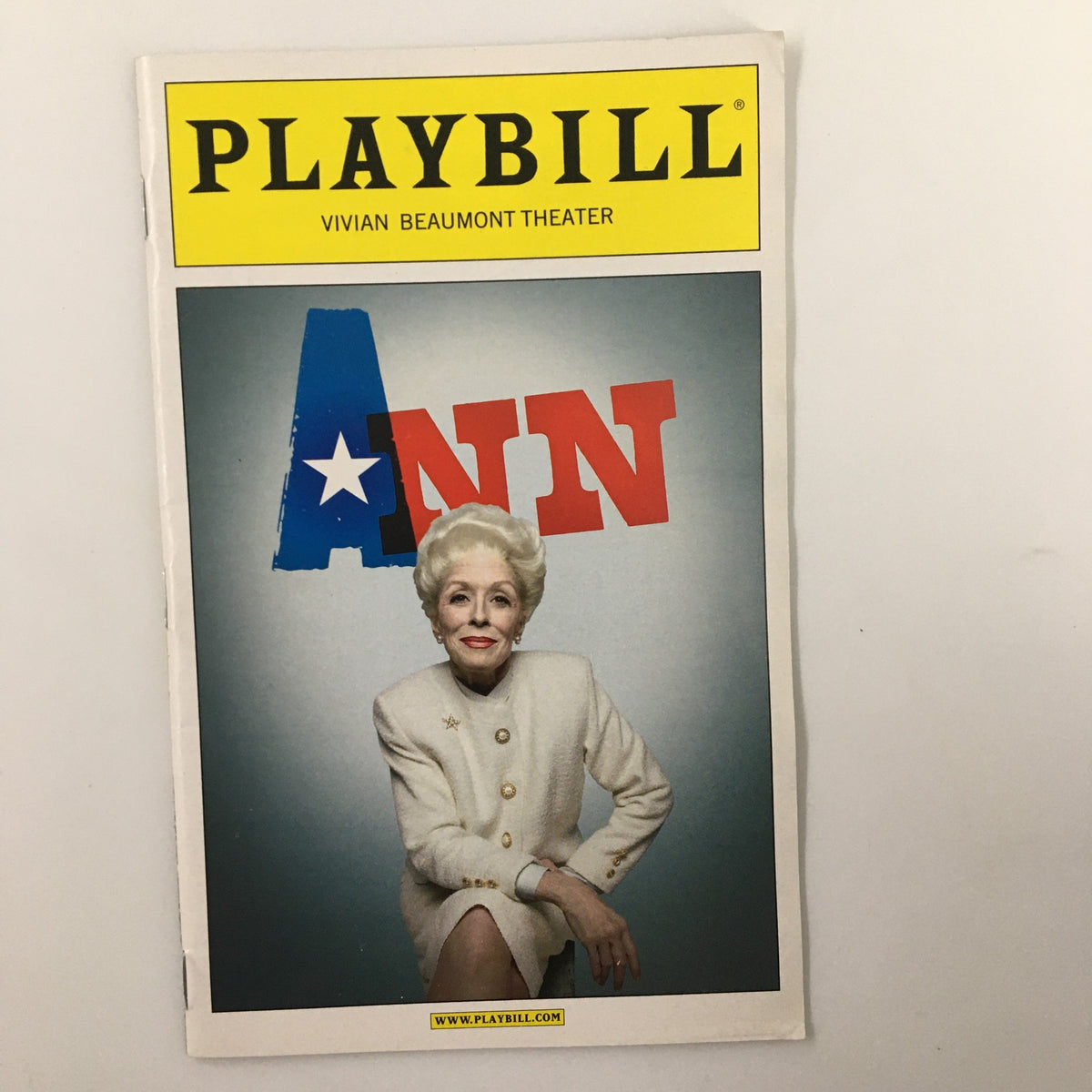 2013 Playbill for the Vivian Beaumont Theater featuring Holland Taylor in the play Ann, showcasing the actress in a stylish white suit against a colorful backdrop with the word 'ANN' prominently displayed.