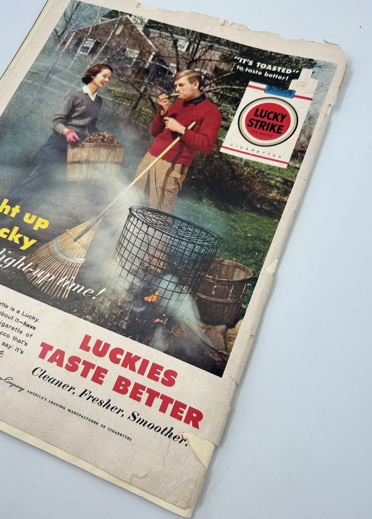 Cover of Collier’s Magazine from November 9, 1956, showcasing an advertising spot for Lucky Strike cigarettes with a man and woman enjoying outdoor activities.