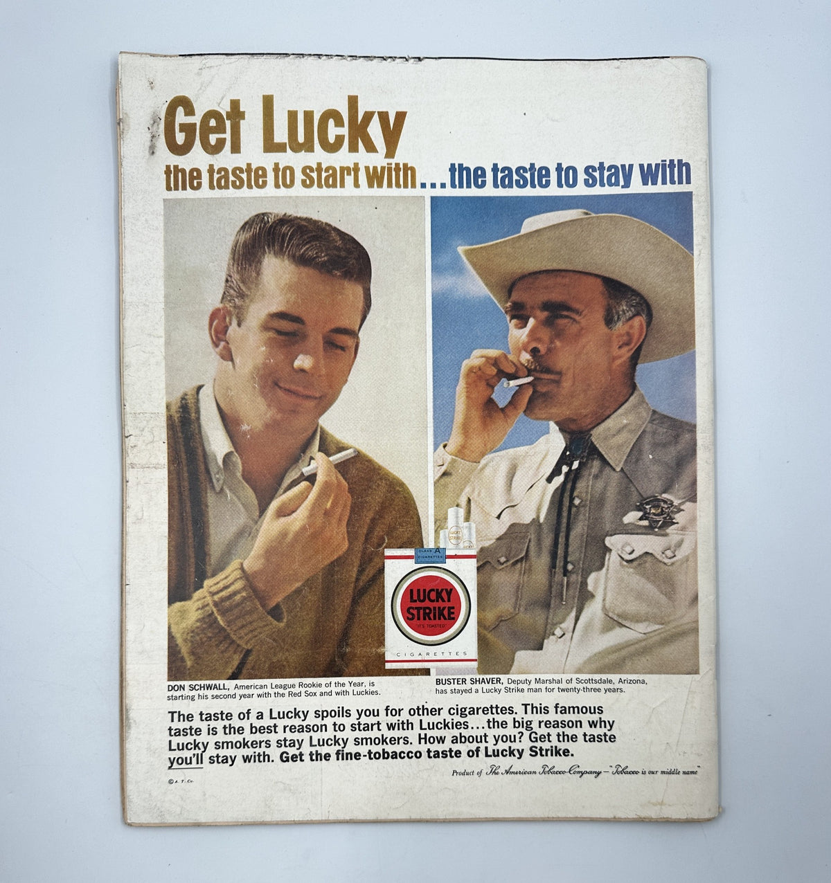 Advertisement featuring a young man and a cowboy promoting Lucky Strike cigarettes, titled 'Get Lucky: the taste to start with... the taste to stay with.' This advertisement is from LIFE Magazine, June 22, 1962.