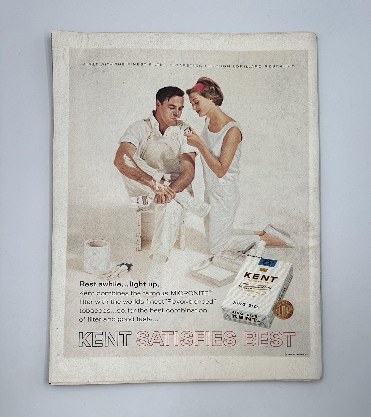 Advertisement for Kent cigarettes in LIFE Magazine October 16, 1964, showcasing the product's unique features and emphasizing quality with the tagline 'Kent Satisfies Best'.