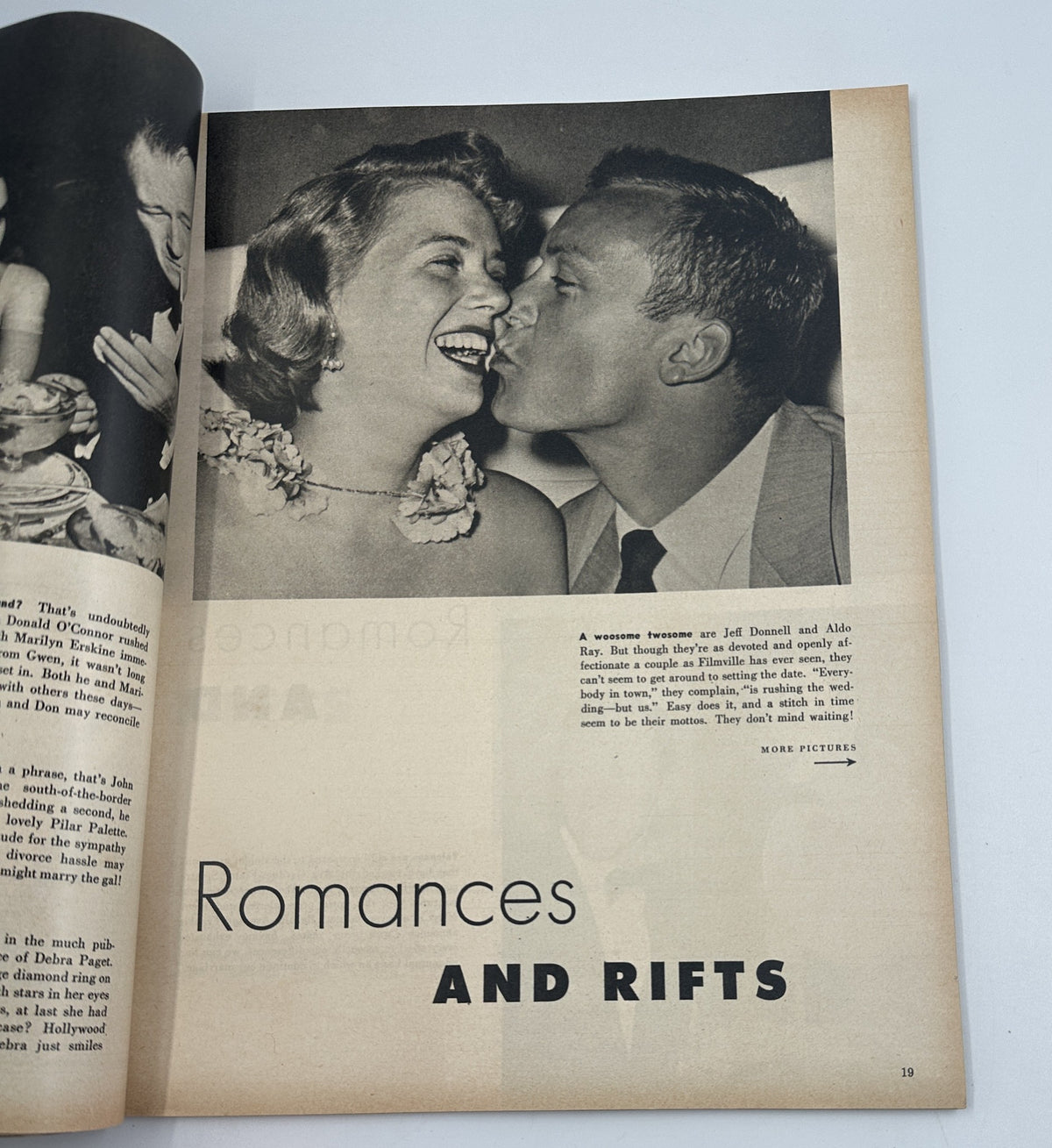 Article page titled 'Romances and Rifts' from the 1954 Photoplay Annual Magazine, featuring a couple in a candid photo, exploring celebrity relationships.