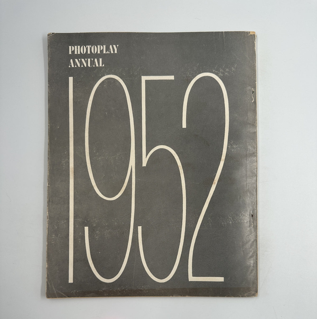 Cover of the Photoplay Annual Magazine 1952, displaying a bold design with the year prominently featured, representing classic Hollywood and its stars.