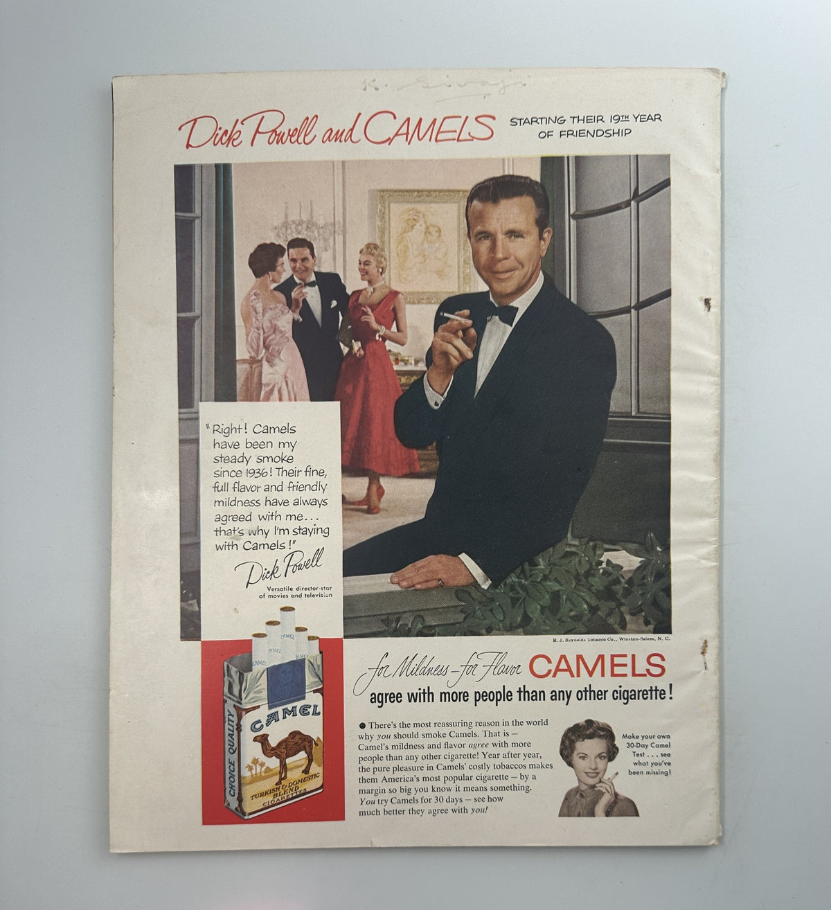 Cover of Screen Stories Magazine from October 1954 featuring Jean Simmons and Grace Kelly. Includes an advertisement for Camel cigarettes with actor Dick Powell. The magazine highlights film features from 'The Egyptian,' showcasing vintage Hollywood glamour.