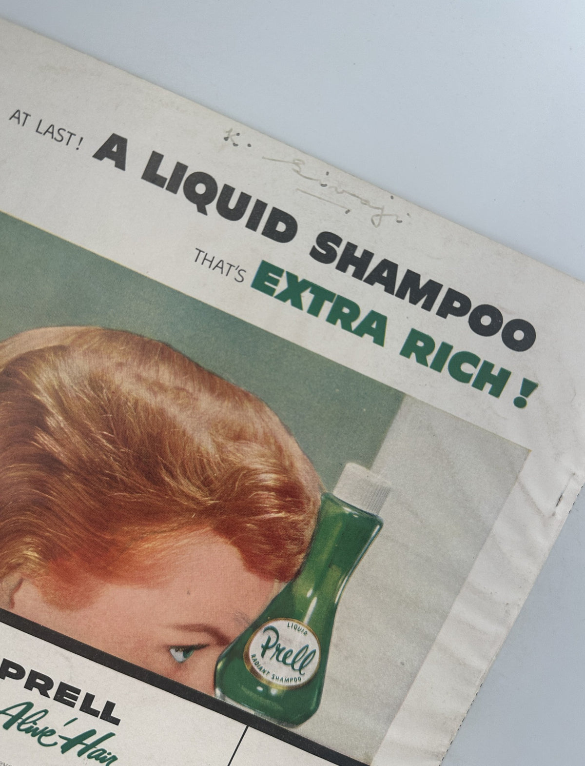 Screen Stories Magazine December 1955 displaying an advertisement for Prell Liquid Shampoo, featuring a woman with lush hair and highlighting the product as 'extra rich.'