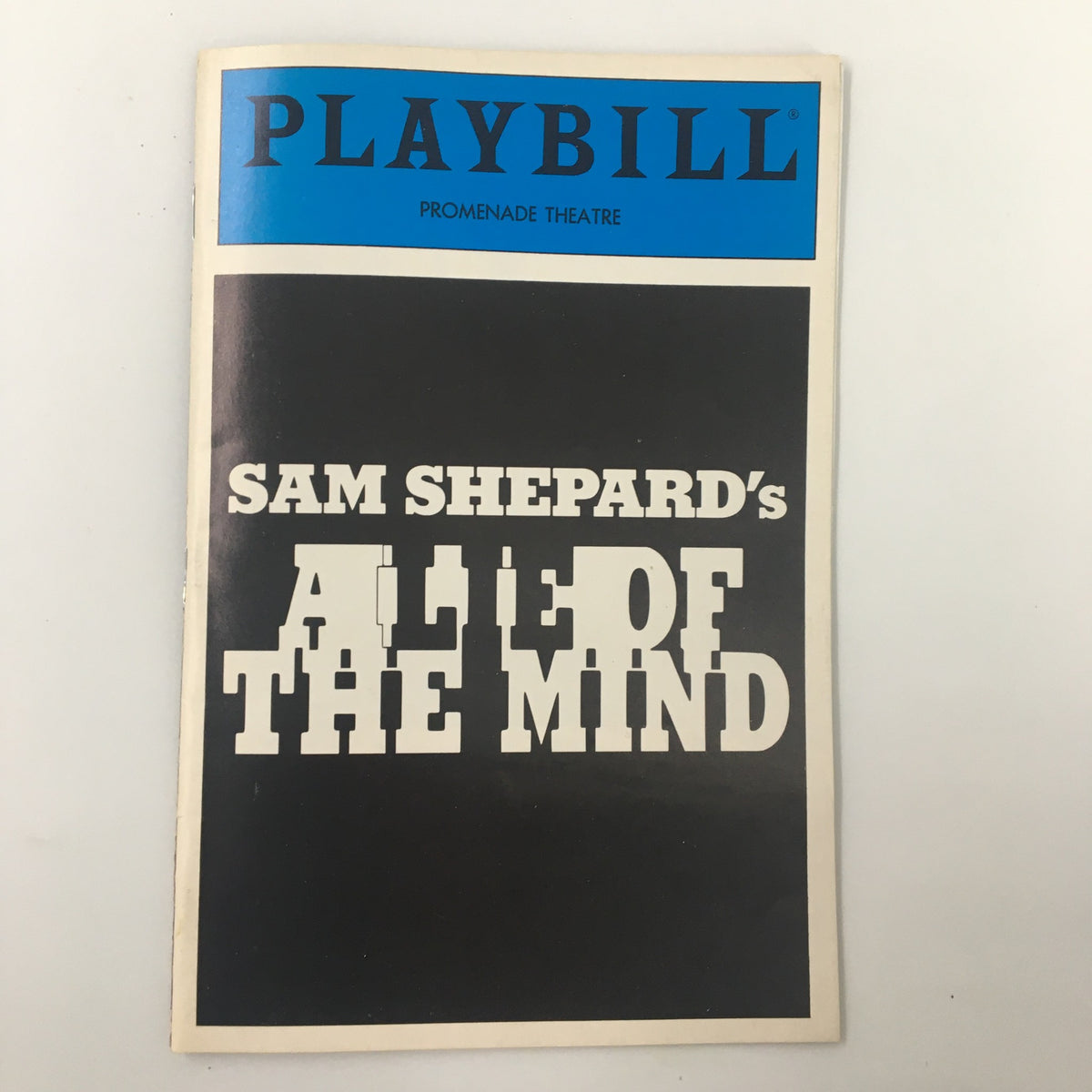 1986 Playbill from the Promenade Theatre featuring Sam Shepard's A Lie of The Mind. This collectible item showcases the title in bold lettering with a classic theater aesthetic.