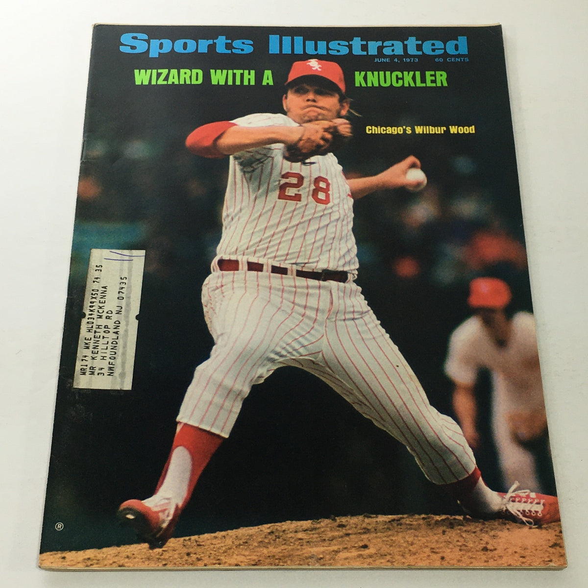Sports Illustrated June 4 1973 cover featuring Chicago's Wilbur Wood, the 'Wizard With A Knuckler,' showcasing the iconic moment of Wood pitching during a baseball game.