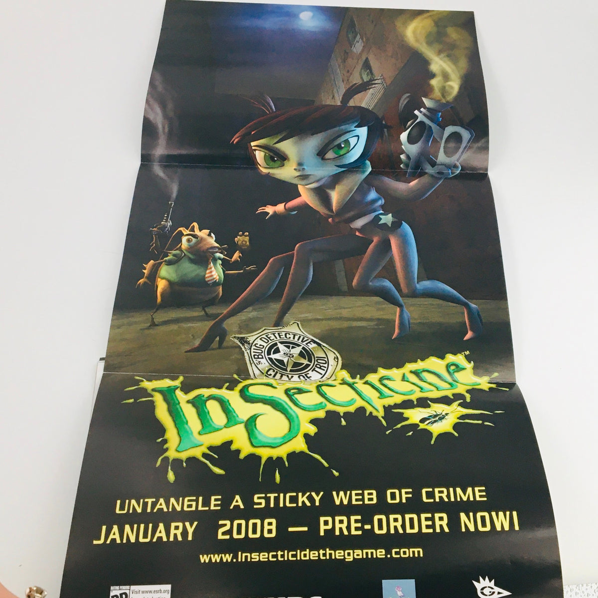 Attached promotional poster from Nintendo Power Magazine December 2007 for Insecticide, alerting gamers to pre-order availability for January 2008.