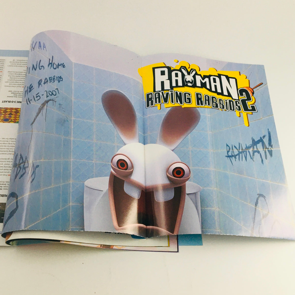 Nintendo Power Magazine January 2008 - Centerfold advertisement for Rayman Raving Rabbids 2, featuring the iconic rabbit character in a imaginative setting.