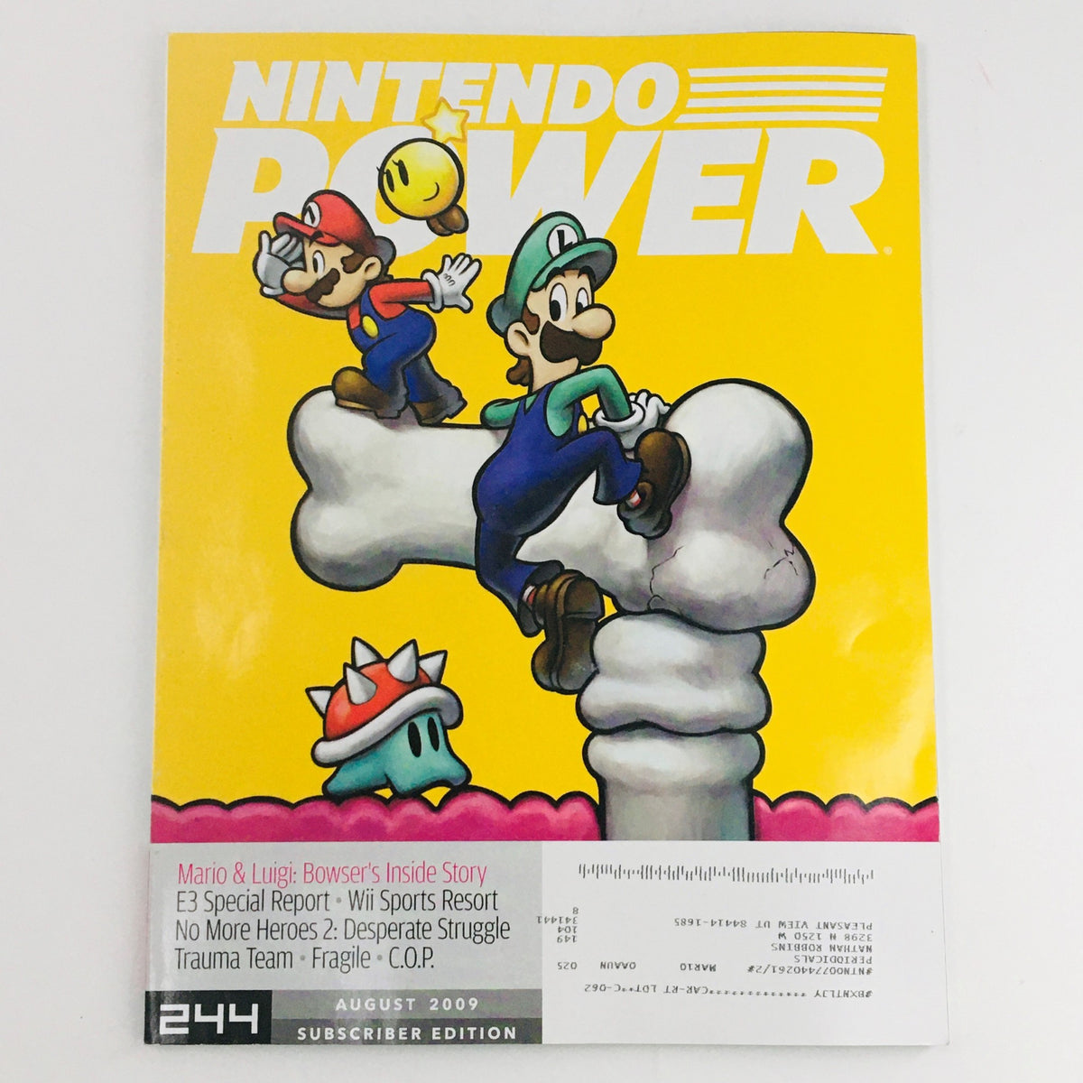 Nintendo Power Magazine August 2009 cover featuring Mario and Luigi with a whimsical background, highlighting the game Mario & Luigi: Bowser's Inside Story.