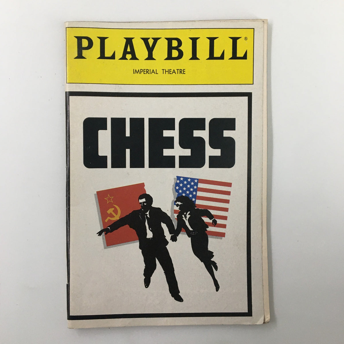 1988 Playbill for Chess at the Imperial Theatre featuring artwork with the title 'Chess' and silhouettes of two characters, one representing the Soviet Union and the other the USA.