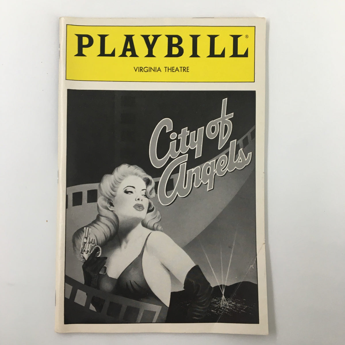 1990 Playbill for City of Angels at Virginia Theatre featuring a striking black and white cover illustration and the iconic Playbill logo.