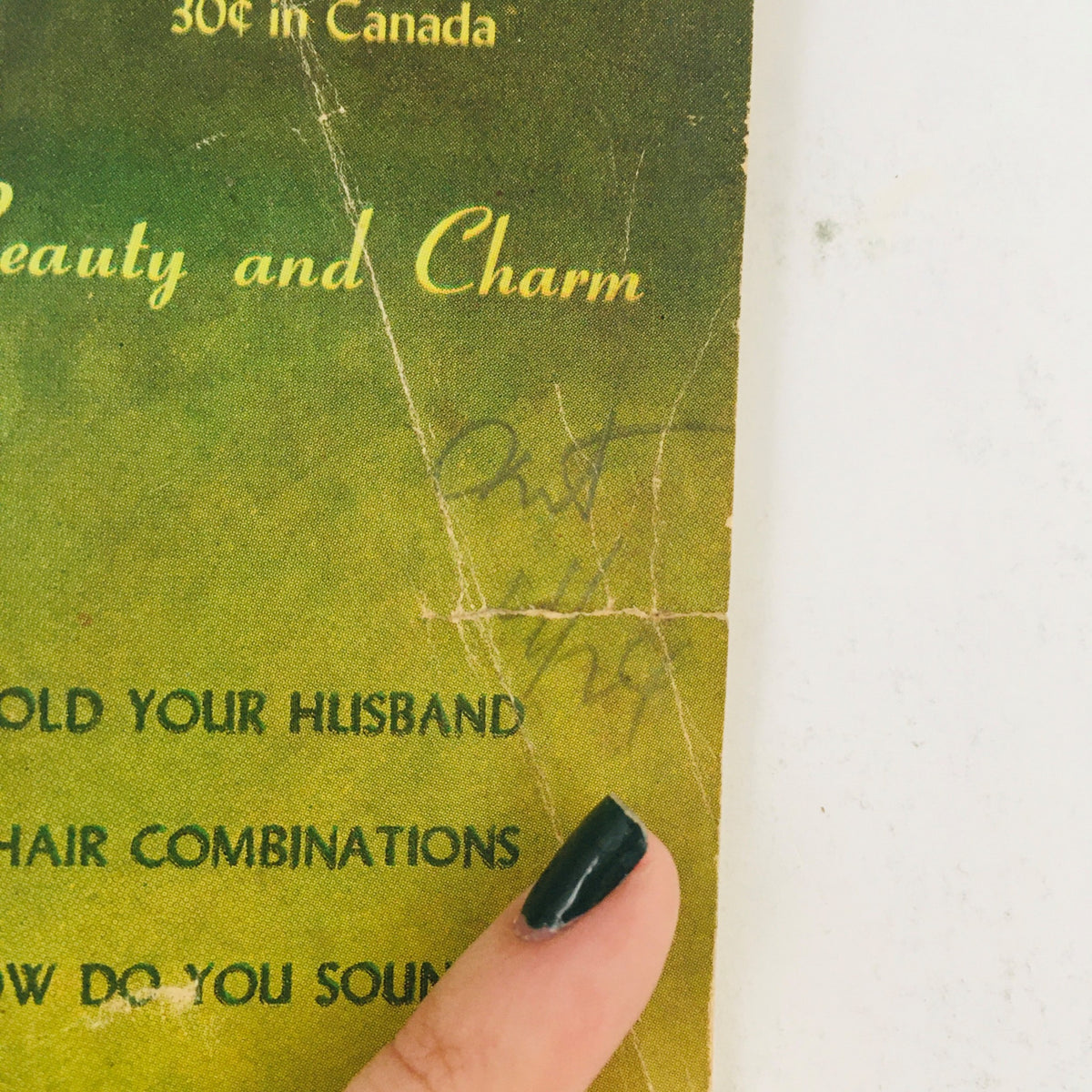 Close-up detail of the VTG Beautify Your Figure Magazine cover from 1945 highlighting the text 'How To Hold Your Husband' and other features, showcasing vintage charm.