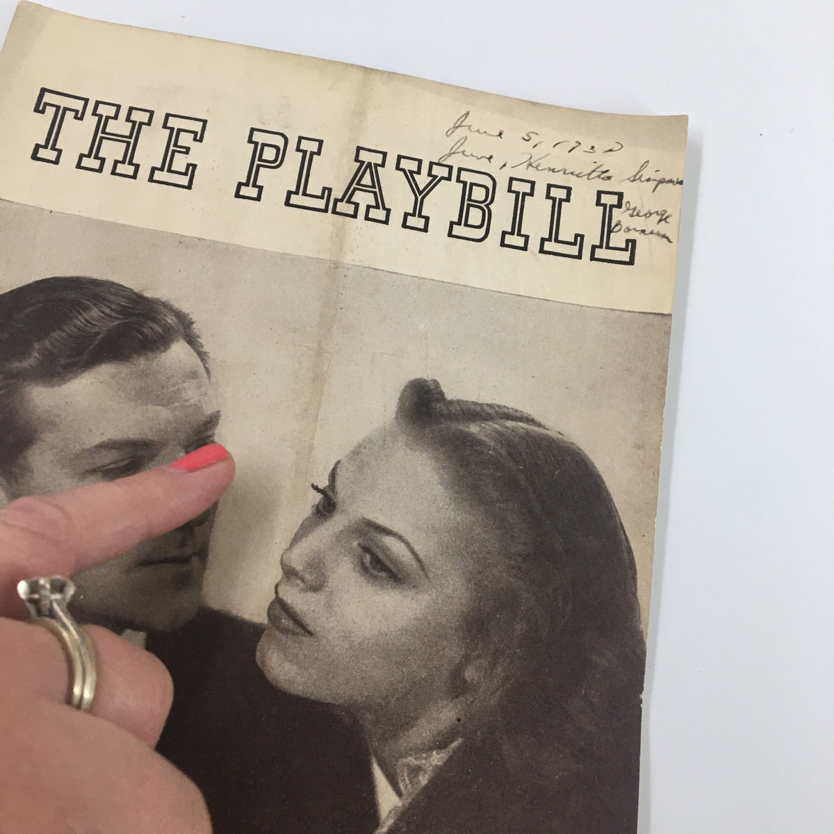 Close-up view of the 1938 Playbill from Sam S. Shubert Theatre for I Married An Angel, showing the cover and a finger pointing to the actors.