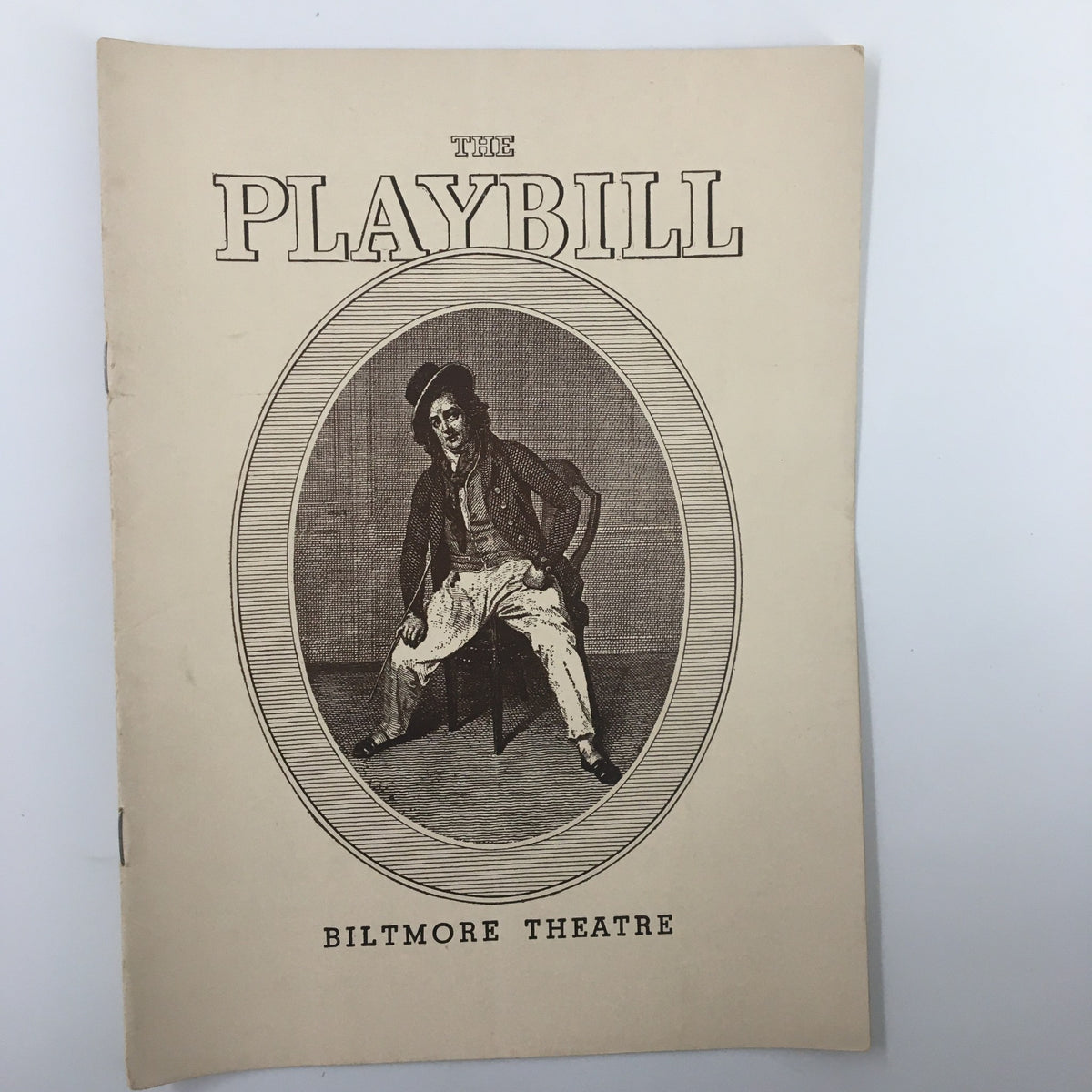 1939 Playbill for 'The Woman Brown', A New Play by Dorothy Cumming at Biltmore Theatre, featuring an illustration of a seated actor in vintage style.