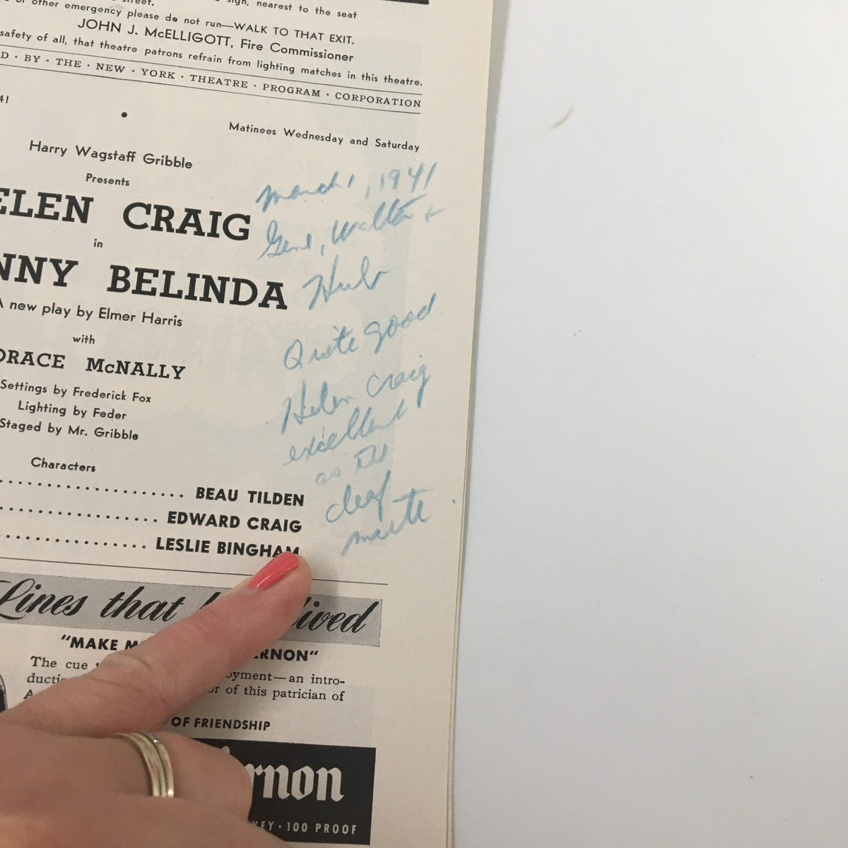 Detail view of the 1941 Playbill for Johnny Belinda showing handwritten notes and character listings, with a hand pointing, revealing insights into the production and Helen Craig's performance.