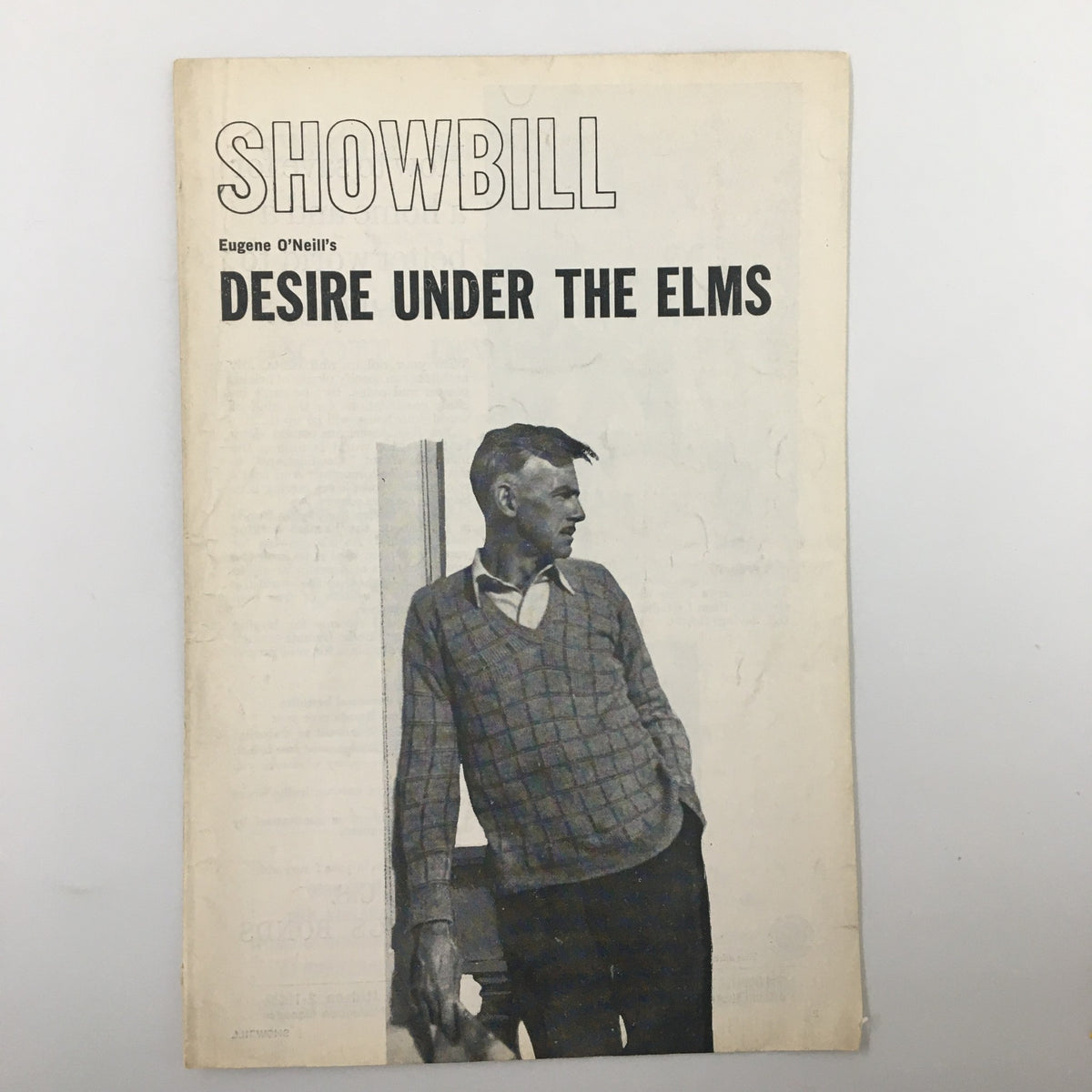 1960 Showbill for Eugene O'Neill's 'Desire Under The Elms', featuring a black and white image of a man in a sweater, showcasing the front cover of the playbill.