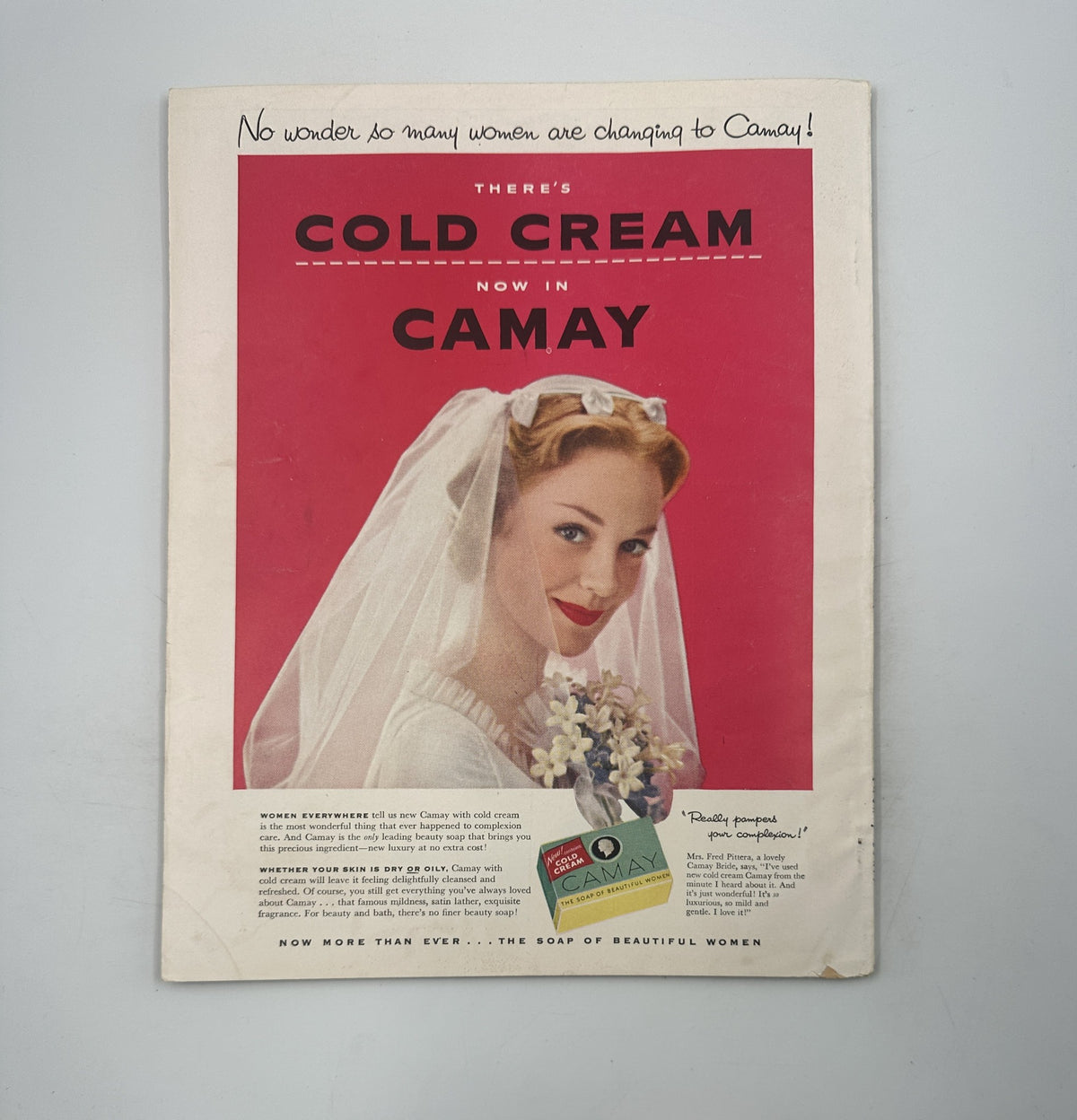 Advertising page from Modern Screen Magazine December 1954 for Camay Cold Cream, featuring a bride in a veil and highlighting the product's appeal to women.