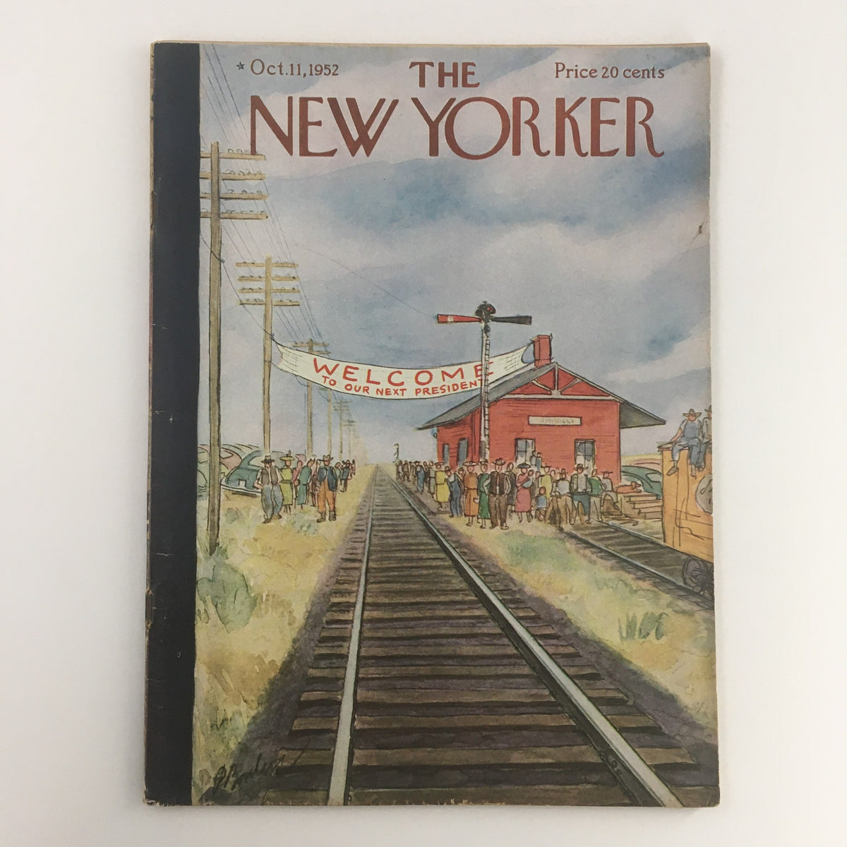 The New Yorker October 11 1952 Full Magazine cover featuring an illustration of a train station scene with a banner reading 'WELCOME TO OUR NEXT PRESIDENT', capturing mid-20th century culture.