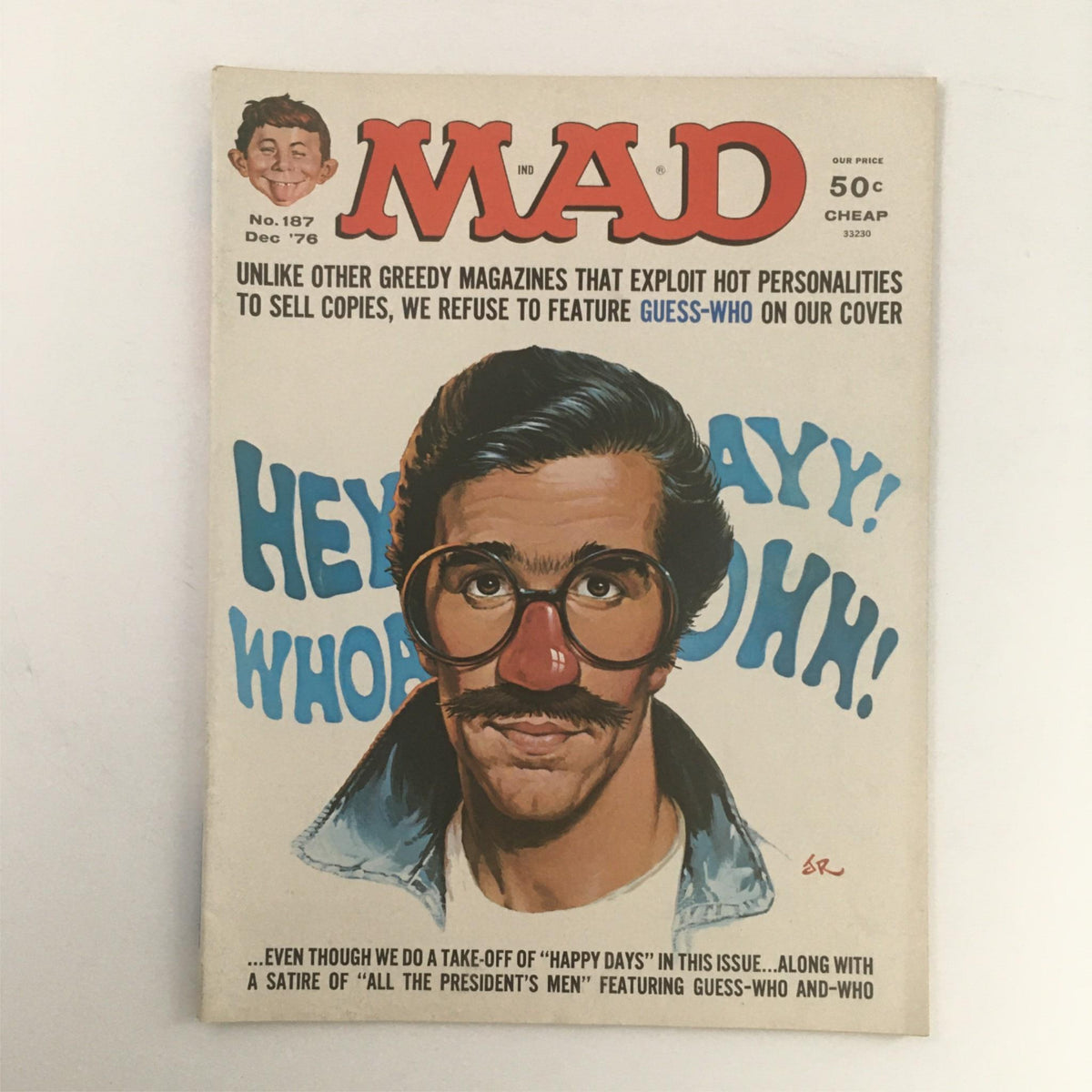 Cover of Mad Magazine December 1976 No. 187 showcasing a playful caricature of Fonzie with exaggerated features, capturing the essence of 1970s pop culture and humor.