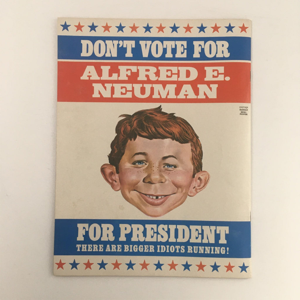 Back cover of Mad Magazine December 1976 No. 187 with a satirical political message featuring Alfred E. Neuman, emphasizing the magazine's iconic irreverent humor.
