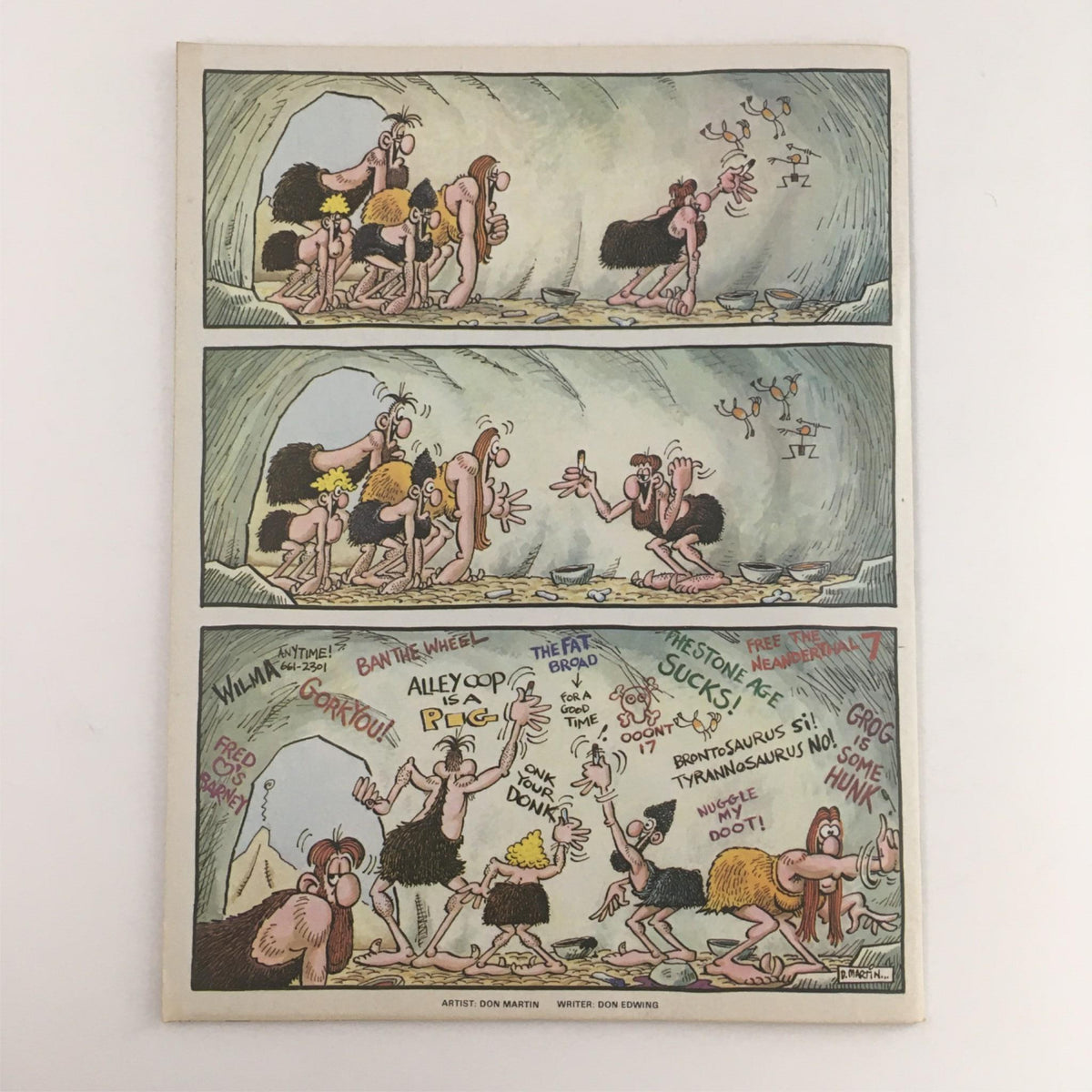 Comic strip from Mad Magazine featuring humorous caveman characters by artist Don Martin. The strip showcases comedic events and dialogues typical of Mad Magazine's satirical style. March 1984 issue.